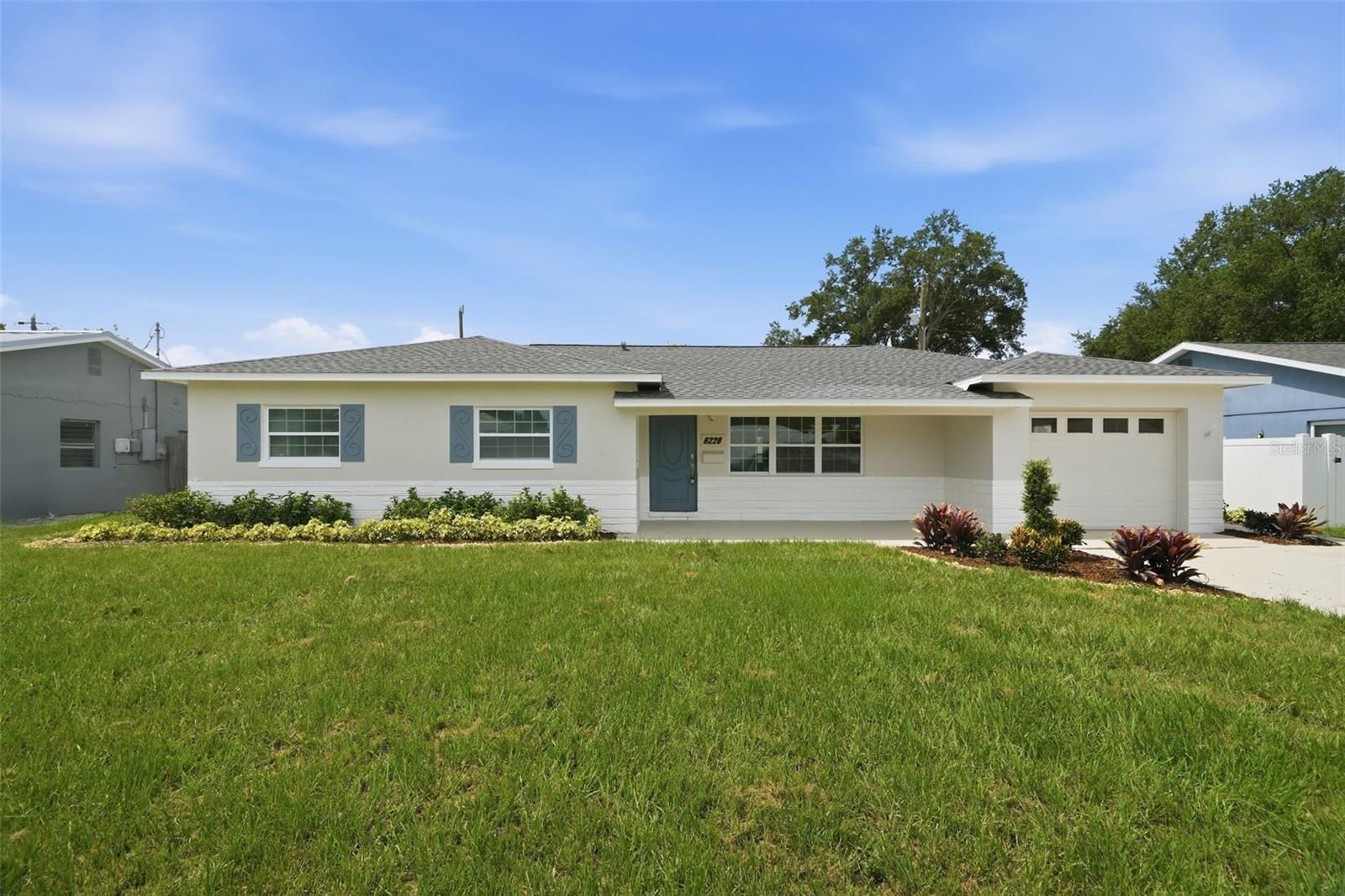 Welcome to this beautifully renovated 3-bedroom, 2-bathroom home that perfectly blends modern updates with everyday comfort in a convenient St. Petersburg location. A fresh exterior transformation featuring new paint, lush sod, updated landscaping, a welcoming front porch, and a brand-new roof sets the tone for the quality updates found throughout the home. Inside, the home has been completely refreshed with fresh interior paint, luxury vinyl plank flooring throughout the main living areas, and stylish finishes that create a bright and inviting atmosphere. The updated kitchen is designed for both everyday living and entertaining, featuring shaker-style cabinetry, stainless steel appliances, brand-new upgraded quartz countertops, and a functional layout that opens seamlessly to the home’s living spaces. Both bathrooms have been fully renovated with modern finishes and fixtures, providing a clean, contemporary feel throughout. A spacious rear bonus room adds valuable flexible living space and is perfect for a second family room, media room, home office, playroom, or fitness area. Additional upgrades include a brand-new roof, updated HVAC, updated lighting, fresh finishes throughout, and move-in-ready condition that allows you to start enjoying your new home immediately. Enjoy outdoor living from the rear paver patio, ideal for grilling, relaxing, or entertaining guests. The one-car garage provides additional storage and includes a dedicated laundry area. Conveniently located near shopping, dining, parks, major highways, downtown St. Petersburg, and everyday conveniences, this beautifully updated home offers the perfect combination of style, comfort, and accessibility. With a brand-new roof, updated HVAC, fully renovated bathrooms, updated kitchen, and flexible bonus living space, the hard work has already been done—simply move in and enjoy.