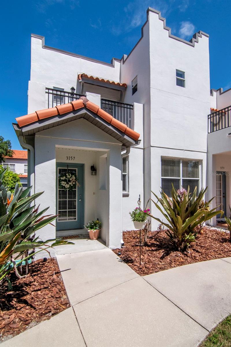 Experience the perfect blend of single-family privacy and low-maintenance luxury in this stunning, light-filled end-unit townhome. Boasting over 1,700 square feet of beautifully renovated living space, this 3-bedroom, 2.5-bathroom 2 story gem feels incredibly spacious and shares only one wall with your neighbor.   Step inside to find gorgeous new wood flooring downstairs, complemented by arched doorways and modern light fixtures. The heart of the home is the newly updated kitchen, featuring sleek cabinetry, premium quartz countertops and a massive walk-in pantry.  Upstairs, you'll find plush updated carpeting, spacious bedrooms, and a super-convenient laundry room. Start your mornings with a cup of coffee on your private balcony, enjoying peaceful views of tree-lined 6th Street. A rare find for townhome living, this property also includes a spacious attached 2-car garage. An Oasis of Carefree Living: The community has recently undergone major high-end updates, including fresh exterior paint, newly paved roads, and upcoming landscaping. Your monthly HOA fee is a massive value-add, covering water, sewer, trash, irrigation, landscaping, common grounds, and total exterior maintenance (including the roof!). The Location: Take a dip in the lovely community pool or take your pup to the neighborhood dog park. Best of all, you are just moments away from the iconic Bayshore Boulevard, top-tier shopping, trendy restaurants, and everything that makes South Tampa one of the most desirable areas in town. Don't miss out on this turnkey South Tampa paradise!
