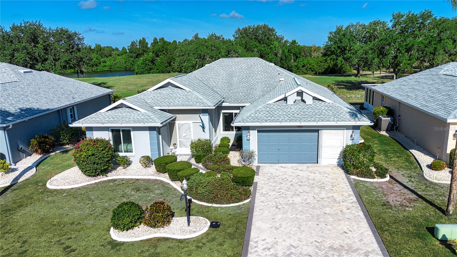 If you are looking for a home on a quiet street with little traffic in one of the best neighborhoods in Sun City Center, this is one that you are not going to want to pass up.
This expanded St. Thomas floor plan home is located in the 55+ retirement community of Sun City Center, FL, which has been recognized as one of the best retirement communities in the country.  The home features 2,179 sq. ft. of air-conditioned floor space, has 2 bedrooms, 2 baths, a den/office, a 2-car garage and impact windows. This home also is on the second hole of the Caloosa Country Club, which is the only private golf course in Sun City Center.  
As you approach the home you are greeted with a well-maintained yard with mature landscaping and a paver driveway and walkway that leads you to the front screened-in porch, which is a great spot to enjoy your morning coffee.  As you enter the home, you can’t help but to notice how bright and airy the interior is.  All the natural light is provided by the front door’s sidelight and transom, the volume ceilings, and all the windows in the back of the house overlooking the golf course. 
In the front of the house, you will find the guest bedroom and bath and a beautiful office with hardwood floors and hardwood cabinets along with a murphy bed if you need that extra bedroom space for visiting family or guests.
The living room and the expanded family room are open to each other that provides you with a great place to visit with family and friends or to entertain a large group of people.  The well laid out eat-in kitchen, which is also open to the family room, provides you with ample cupboard and counter space.  The adjacent dining room has the same beautiful hardwood floors as the office space.
Your master suite has picturesque views of the golf course and is of ample size for king size furniture.  There are his and hers walk-in closets and a large en-suite bath with a walk-in shower, garden tub and double vanity. 
To truly appreciate what this home has to offer, the best thing to do is to make an appointment to see it before it’s too late!