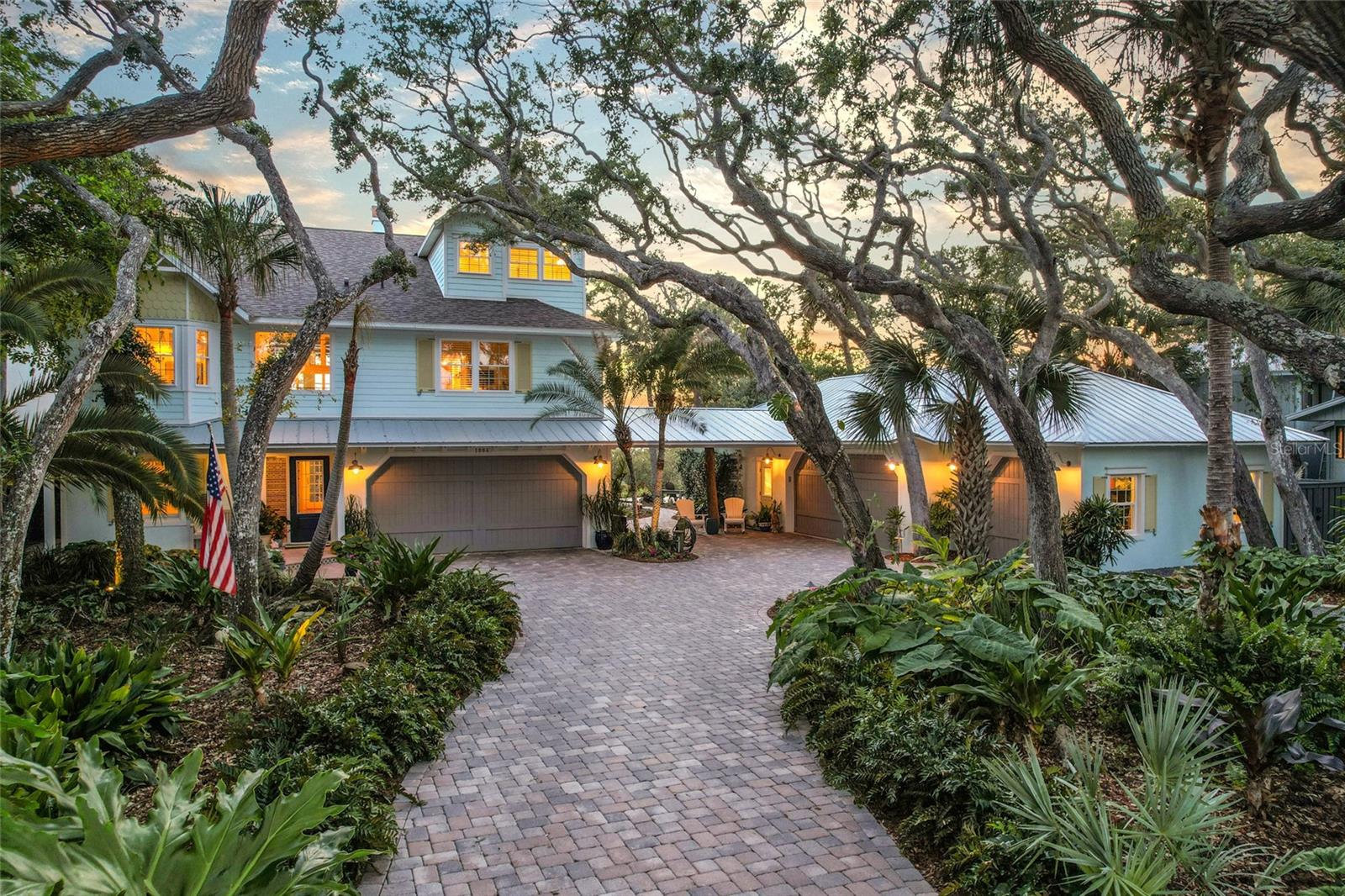 Positioned on a rare 100’ wide frontage spanning four combined lots in coveted Flagler Beach, this meticulously maintained coastal retreat offers unobstructed marsh views and an exceptional blend of privacy, space, and functionality rarely found this close to the beach. The home features 3 bedrooms, 3 bathrooms, plus a dedicated office or optional 4th bedroom on the main level. Inside, engineered hardwood floors, 12’ ceilings in the main living area, and a gas fireplace create a warm yet elevated coastal feel, while expansive windows capture the natural beauty surrounding the property. Car enthusiasts, boaters, and outdoor adventurers will appreciate the impressive 6-car garage setup, including a separate air-conditioned workshop space. The property also features ample parking with wraparound paver and rock driveways.

The outdoor living experience is equally exceptional. Surrounded by expansive landscaping with irrigation and landscape lighting, the backyard is designed to fully embrace the coastal lifestyle. A one-of-a-kind saltwater pool with natural rock waterfall features, spa, and solar creates a private resort-style oasis. Multiple outdoor gathering spaces include two wood decks with a fire pit and built-in park grill, while the breezeway with outdoor shower adds convenience after beach days. Every inch of the property has been thoughtfully maintained and upgraded, offering a truly move-in-ready experience.

Located just three blocks from the ocean and moments from Wickline Park, the Flagler Beach Public Library, local restaurants, shops, and the boat launch, this home offers an unmatched opportunity to enjoy the laid-back Flagler Beach lifestyle by foot, bike, or golf cart. With unobstructed marsh views, incredible outdoor living, and an oversized homesite that is nearly impossible to replicate, this is a rare opportunity to own one of Flagler Beach’s most unique and special properties.