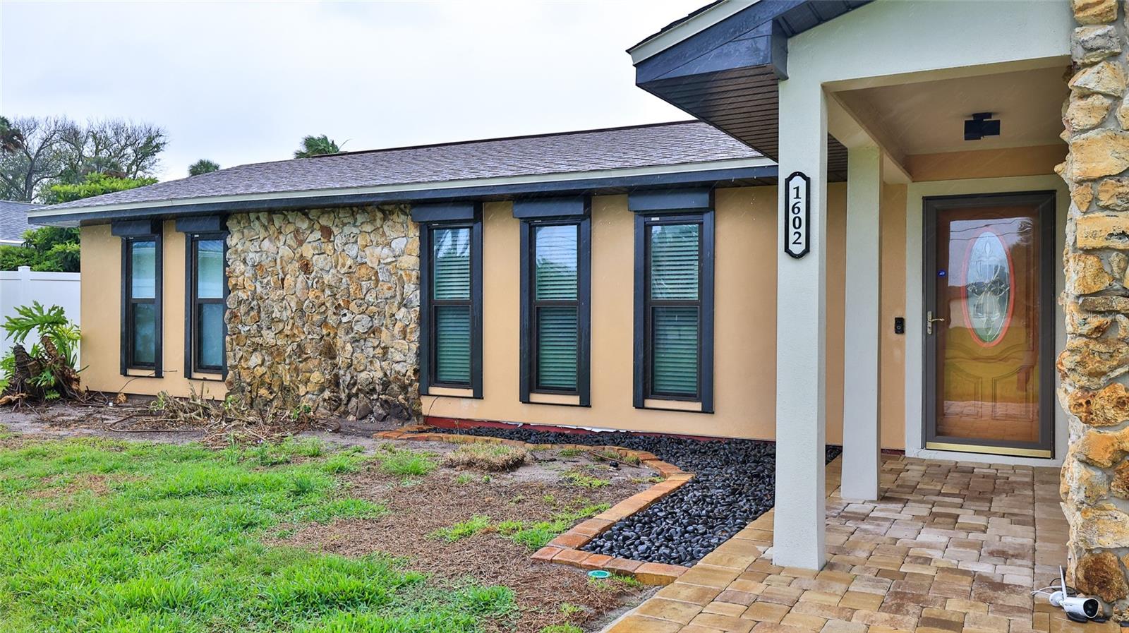 Location, location, location! Beautifully expanded in 2020, this spacious 4-bedroom, 3.5-bath home blends modern comfort with the relaxed Florida lifestyle. The two-story addition features full impact-rated windows and doors, while the original home received updated windows with hurricane protection in 2021. Home also had a new architectural shingle roof installed recently! (2020) 

Inside, the home is designed for efficiency and versatility. The original section is cooled by a geothermal central air system—quiet, durable, and free of exterior equipment—while the addition includes four heat-pump ductless mini-splits for personalized climate control. Both the new and existing areas are equipped with tankless water heaters (gas and electric).

A generous two-deep paved driveway accommodates up to eight vehicles, and the backyard offers a sizable paved patio perfect for outdoor dining or enjoying coastal breezes.

The downstairs portion of the new addition includes a full secondary kitchen and laundry, making it ideal for an in-law suite or a rentable apartment. Its flexible design allows it to function as a separate unit or integrate seamlessly with the main home through double doors.

Upstairs, a glass-enclosed, air-conditioned balcony invites you to unwind while taking in views of rocket launches from the nearby space coast or fireworks over the beach.

Located just moments from the river, this home offers easy access to kayaking, boating, fishing, and the best of the Florida outdoor lifestyle. Enjoy peaceful mornings by the water, quick trips to the shoreline, and the unique blend of tranquility and adventure that this area is known for. All information is deemed to be accurate but is not guaranteed.