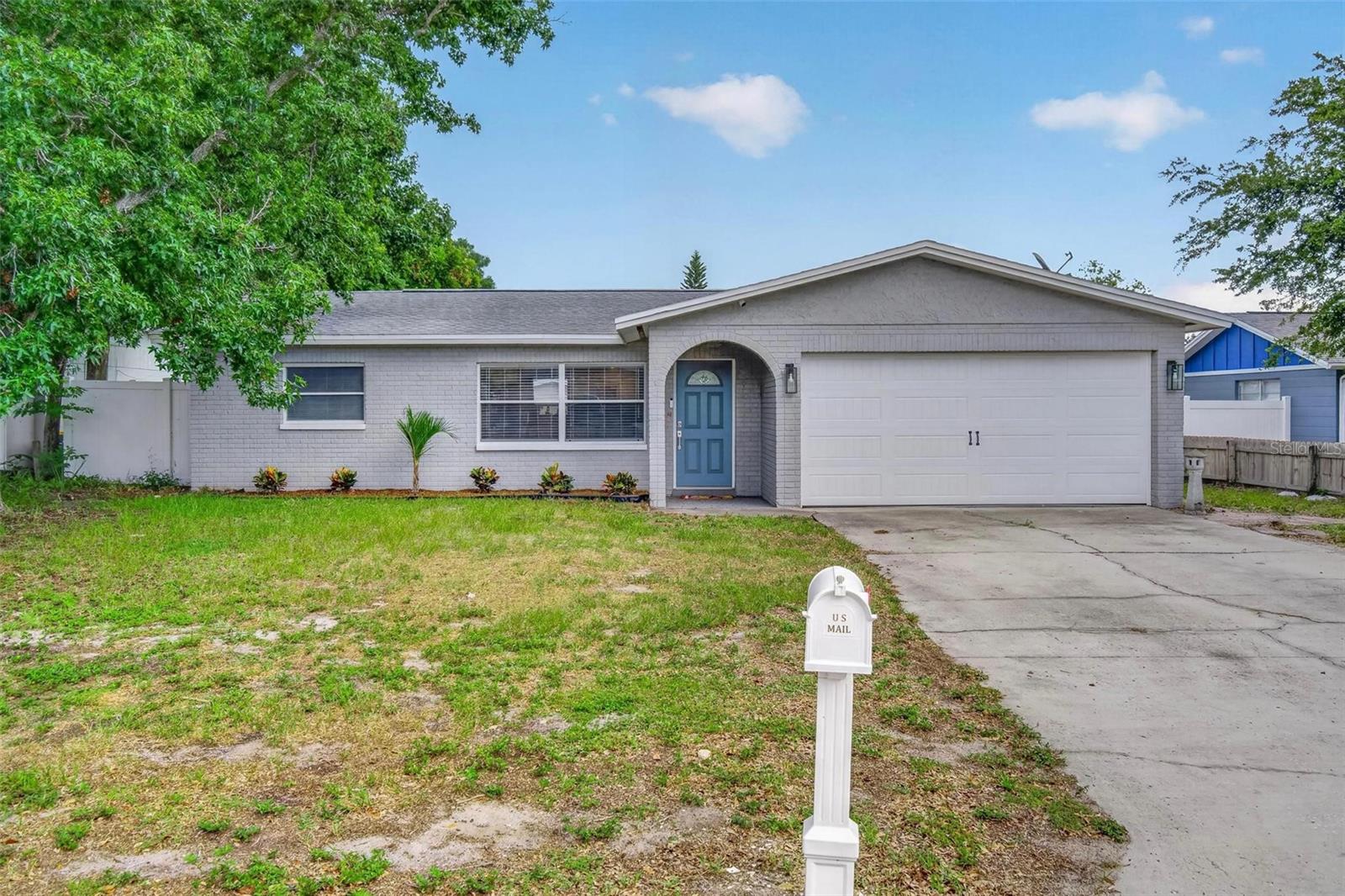 Light, bright, beautiful and ready for the next buyer! Come check out this beautiful, well-cared for ranch style home on a quiet cul de sac in lovely Dunedin. This three bedroom, two bathroom split-floor plan home has enough space for everyone! It has been renovated with some tasteful updates, and you'll love the open kitchen and living room floor plan with updated fixtures throughout. But what you might love the most is the backyard! You'll enjoy the additional entertaining space on the huge back deck, and then you can work on your putting game with the putting green! You'll also love the maintenance-easing artificial turf throughout. Close to Countryside, downtown Dunedin, and the beaches, come be the next person to love this home!
