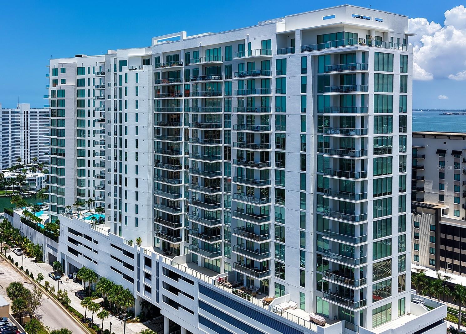 Experience unrivaled downtown Sarasota luxury living at Bayso in this impeccably upgraded 10th-floor G residence. Postioned as one of Bayso's most appealing ownership opportunities, this residence combines luxury, water and skyline views, and exceptional value. This beautifully appointed home presents a rare opportunity to own within one of downtown Sarasota’s premier luxury condominium communities.

Ideally positioned with coveted southern exposure, this 1,578-square-foot condominium showcases breathtaking panoramic views of Sarasota Bay, the Gulf, the marina, and the city skyline from its expansive 222-square-foot private terrace, perfect for outdoor dining, entertaining, or enjoying Sarasota’s iconic sunsets.

This sophisticated two-bedroom, two-and-a-half-bath residence plus den/flex space offers a refined contemporary design with 10-foot ceilings and immaculate attention to detail. The home features designer-selected Italian cabinetry, quartz countertops, a custom glass tile backsplash, premium stainless steel appliances, elegant GROHE fixtures throughout, and custom electric remote blinds and upgraded lighting fixtures in the main living areas and bedrooms. The spacious owner’s suite provides a private retreat with custom California Closets and a spa-inspired bath.

Enjoy the premier downtown Sarasota lifestyle with two dedicated parking spaces and access to Bayso’s impressive collection of resort-style amenities, including an elevated pool and spa, entertainment areas, outdoor kitchen with gas grills, dog park, flex office and boardroom spaces, 24-hour front desk attendants, controlled-access entry, and on-site property management. Perfectly located in the heart of downtown Sarasota, Bayso places you steps from acclaimed dining, boutique shopping, theaters, entertainment, and the revitalized waterfront. Enjoy nearby access to the Bay Conservancy Park with outdoor activities, kayaking, and scenic waterfront spaces. With stunning views, ultra luxurious finishes, and a prime downtown location, this Bayso residence offers the best of Sarasota’s modern coastal lifestyle.