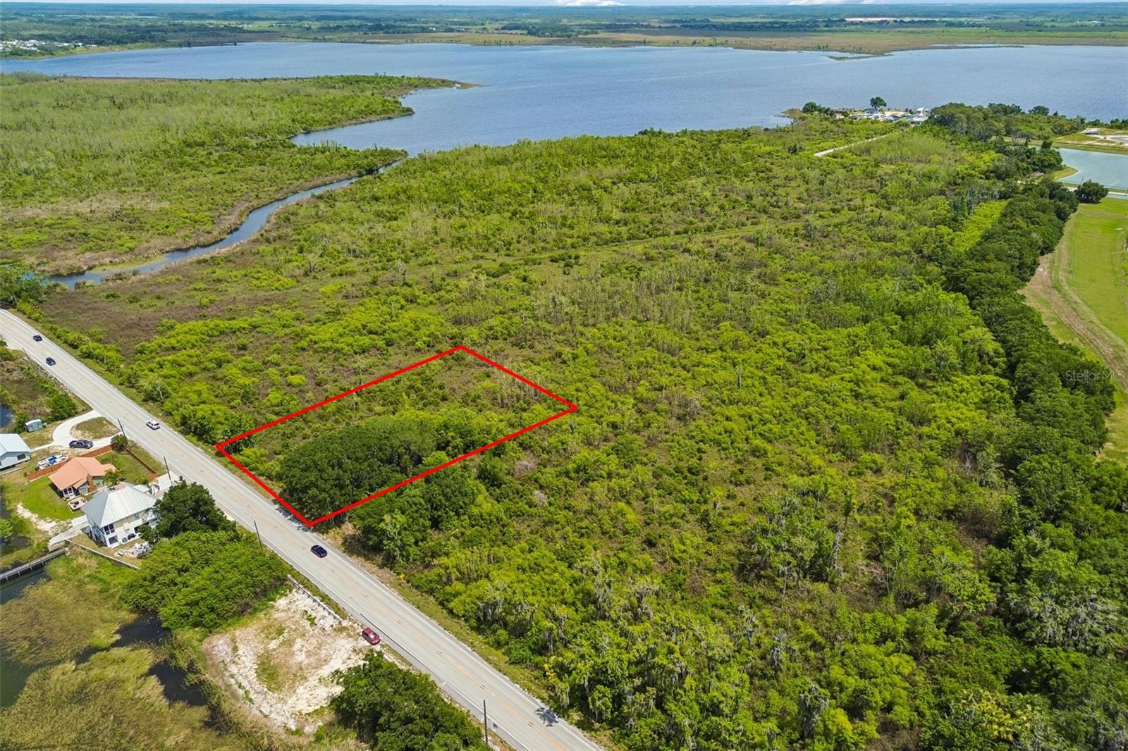 Tucked away in a peaceful area of Auburndale, this .87-acre parcel offers a rare opportunity to build your dream home in a scenic, well-located setting. This vacant residential lot has never been built on, giving you a true blank canvas to design exactly what you want without the limitations of prior structures.

Positioned directly across the road from Lake Juliana, the property enjoys a serene atmosphere with nearby water views and the charm of lakeside living, without the higher costs often associated with direct waterfront lots. With convenient access to I4 as well, you will not have to sacrifice convenience to live peacefully. Whether you’re envisioning a custom home, a private retreat, or an investment build, the generous lot size provides ample space for a variety of layouts, outdoor living areas, and more.

Even better, this property is not located within an HOA, giving you added flexibility and freedom to build and use the land according to your preferences.