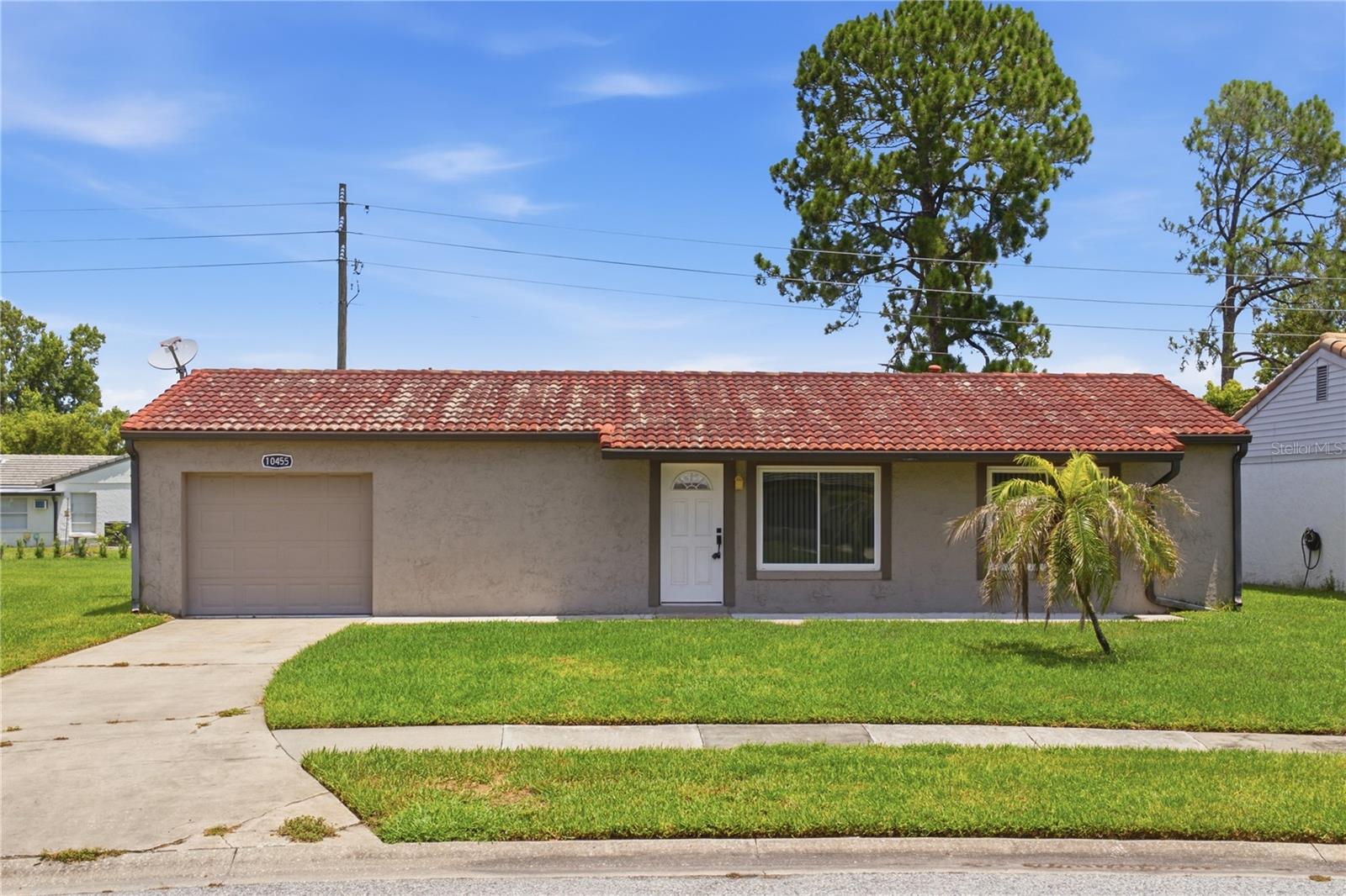 Great opportunity in Orlando's Montpelier Village! This 2-bedroom, 2-bathroom single-family home offers 1,070 SqFt of living space plus a fully air-conditioned sunroom bonus room. Capital improvements provide excellent value, featuring a new A/C (1 year old), roof coating (5 years ago), redone plumbing (6-7 years ago), and a complete electrical rewire in 2006 with flawless performance since. The property is serviced by city water and city sewer. The affordable $100/month HOA fee covers lawn care, maintenance, and HOA irrigation for a truly low-maintenance lifestyle. Additional highlights include an attached 1-car garage, solid block construction, and elegant French doors. Located in Flood Zone X with no minimum lease restrictions and top-rated local schools.