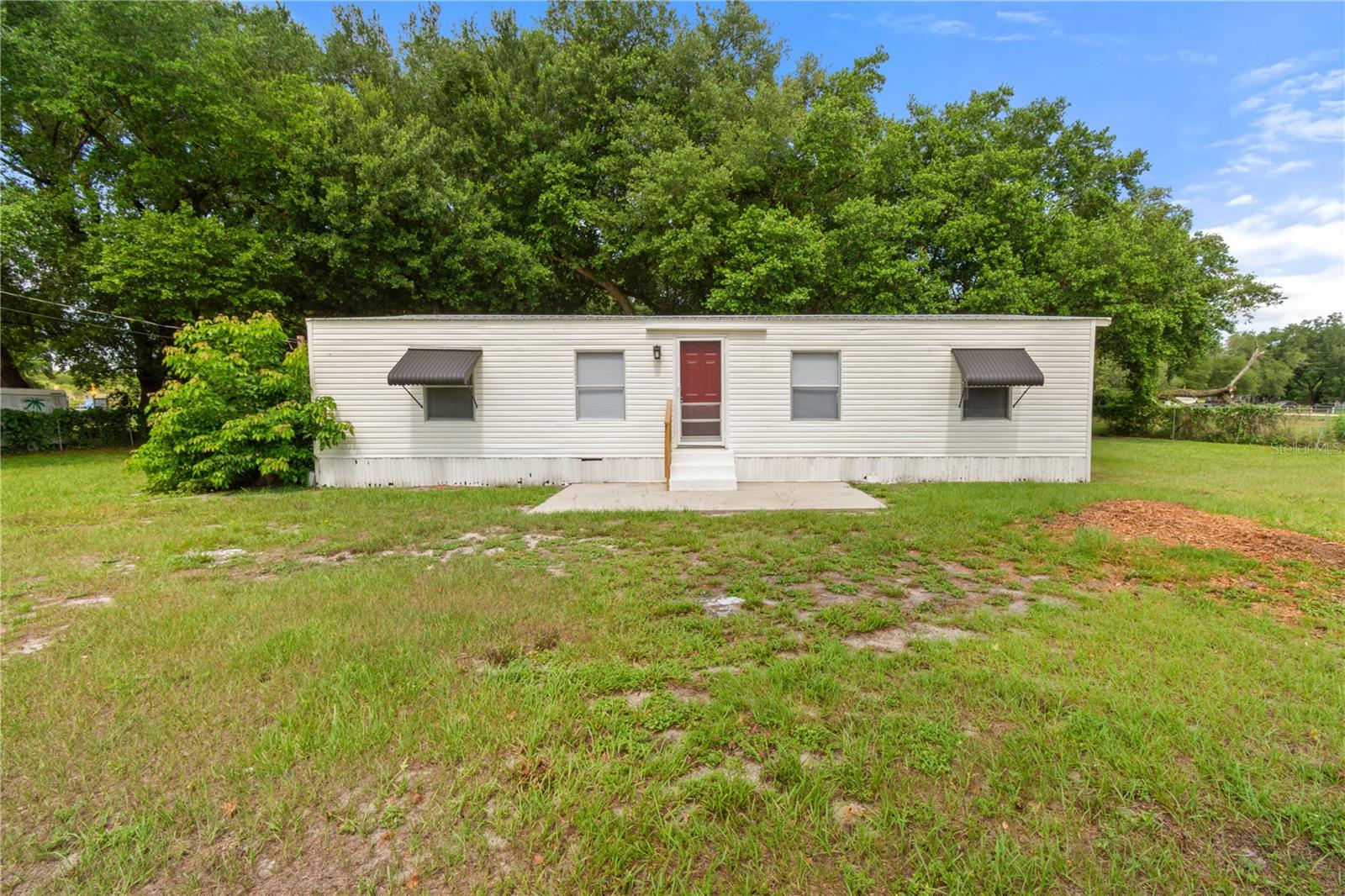 Virtually Staged. Come see this beautifully renovated home featuring plenty of living space with three bedrooms and two bathrooms. The expansive outdoor area sits on over an acre, offering endless possibilities for relaxation, entertaining, gardening, or creating your dream space. Enjoy the beautifully shaded grounds, a spacious barn perfect for projects or hobbies, and plenty of room to host family and friends.
