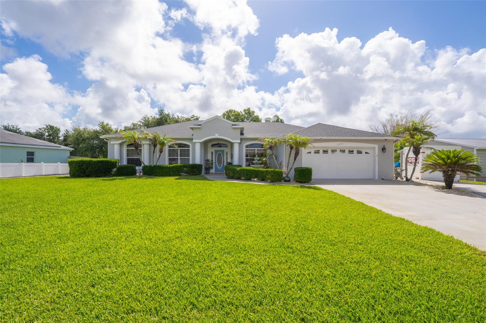 Exceptional 4BR/2.5BA home set on .80 acres, offering the ultimate combination of privacy, entertaining, and utility. This spacious home features a chef's kitchen w/granite, formal living & dining areas & an oversized indoor laundry room. The 4th bedroom features a separate entrance, providing flexibility for guests, a home office or potential multi-generational living setup. Step outside to your private backyard oasis featuring a stunning waterfall heated pool with spa, fully appointed covered summer kitchen complete w/custom cabinetry, 4-burner SS gas cooktop, grill, flat-top griddle, fryer, full-size refrigerator, SS sink and water heater. Convenient pool bath adds extra functionality for guests and outdoor gatherings. Additional highlights include a versatile 3-section pole barn w/water and electric, 30' x 11' lean to for boat storage, fish cleaning station, 24'' x 20'' detached garage w/100 amp service. Roof 2020 A/C 2021 & 2024 HWH 2021 Pool resurfaced 2020