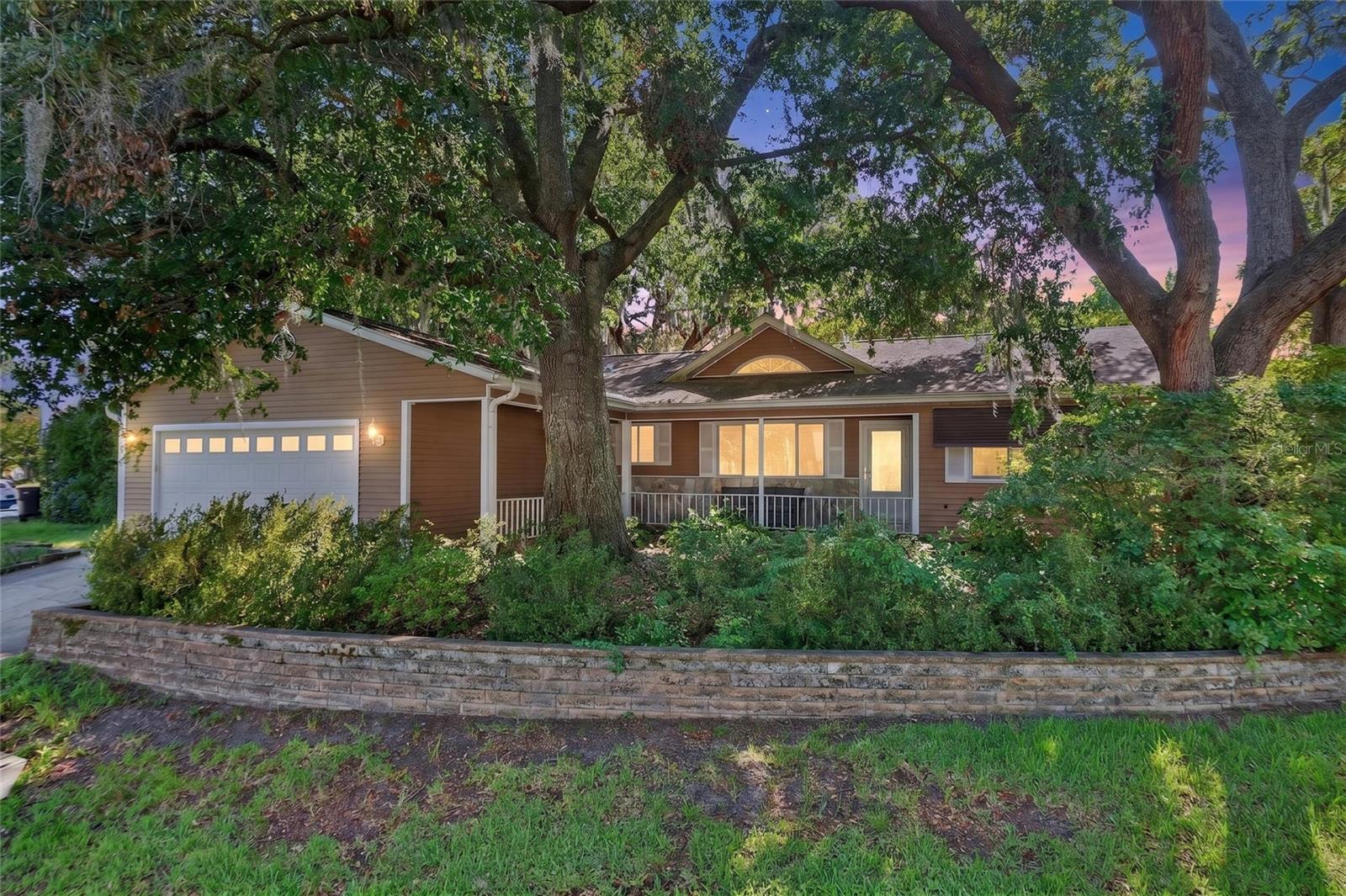 Well-maintained St. Augustine model featuring 3 spacious bedrooms, 2 full bathrooms, and a 2-car garage. This home has been well cared for and offers numerous updates, including a new electrical panel, two hot water heaters, and a roof replaced in 2018. Inside, you'll find a beautiful two-way fireplace that creates a warm and inviting atmosphere between the living areas. Enjoy outdoor living with a private patio off the lanai, a large covered front porch, and attractive, well-maintained landscaping that enhances the home's curb appeal. If you're looking for a move-in ready home with thoughtful updates and exceptional care, this one is a must-see!