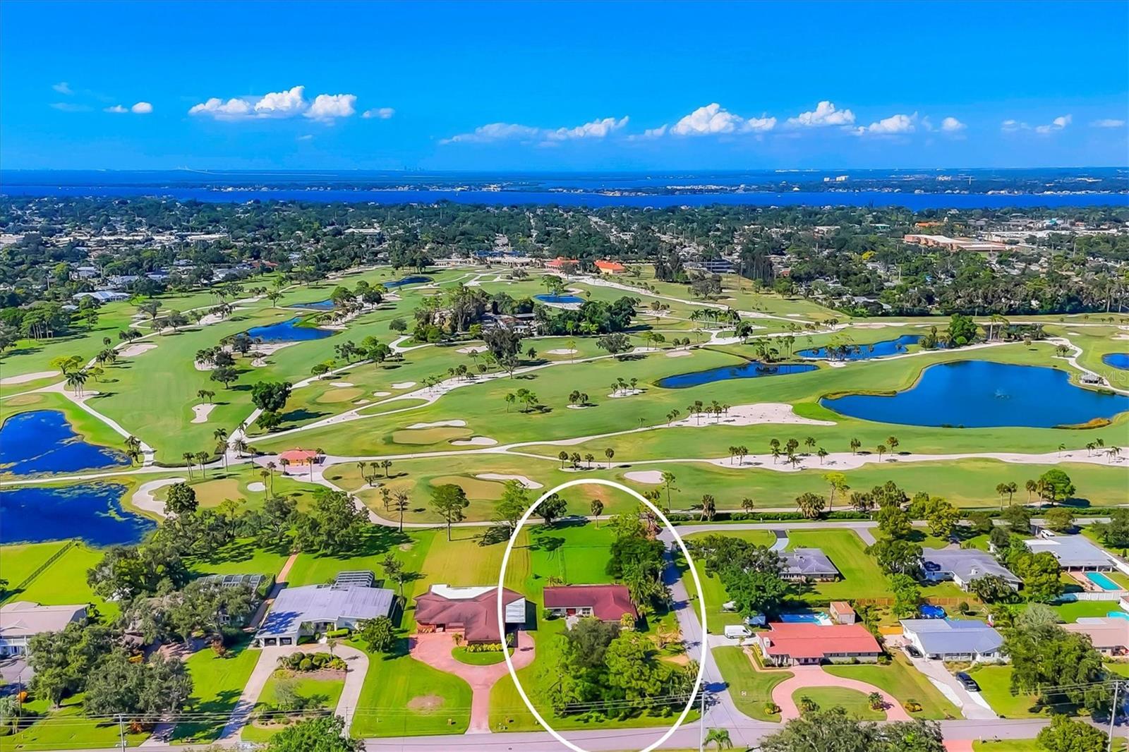 Colossal sized lot with expansive Bradenton Country Club Golf Course views!  At 331.7' deep with 100' feet on the golf course it is suitable to subdivide into two lots on this quiet West Bradenton intersection with no HOA.  Existing home could also be renovated into a dream home overlooking the 4th hole by the green.  Beautiful Mexican tile floors throughout with beamed ceilings create a cool and spacious living area.  An excellent investment project from any angle.