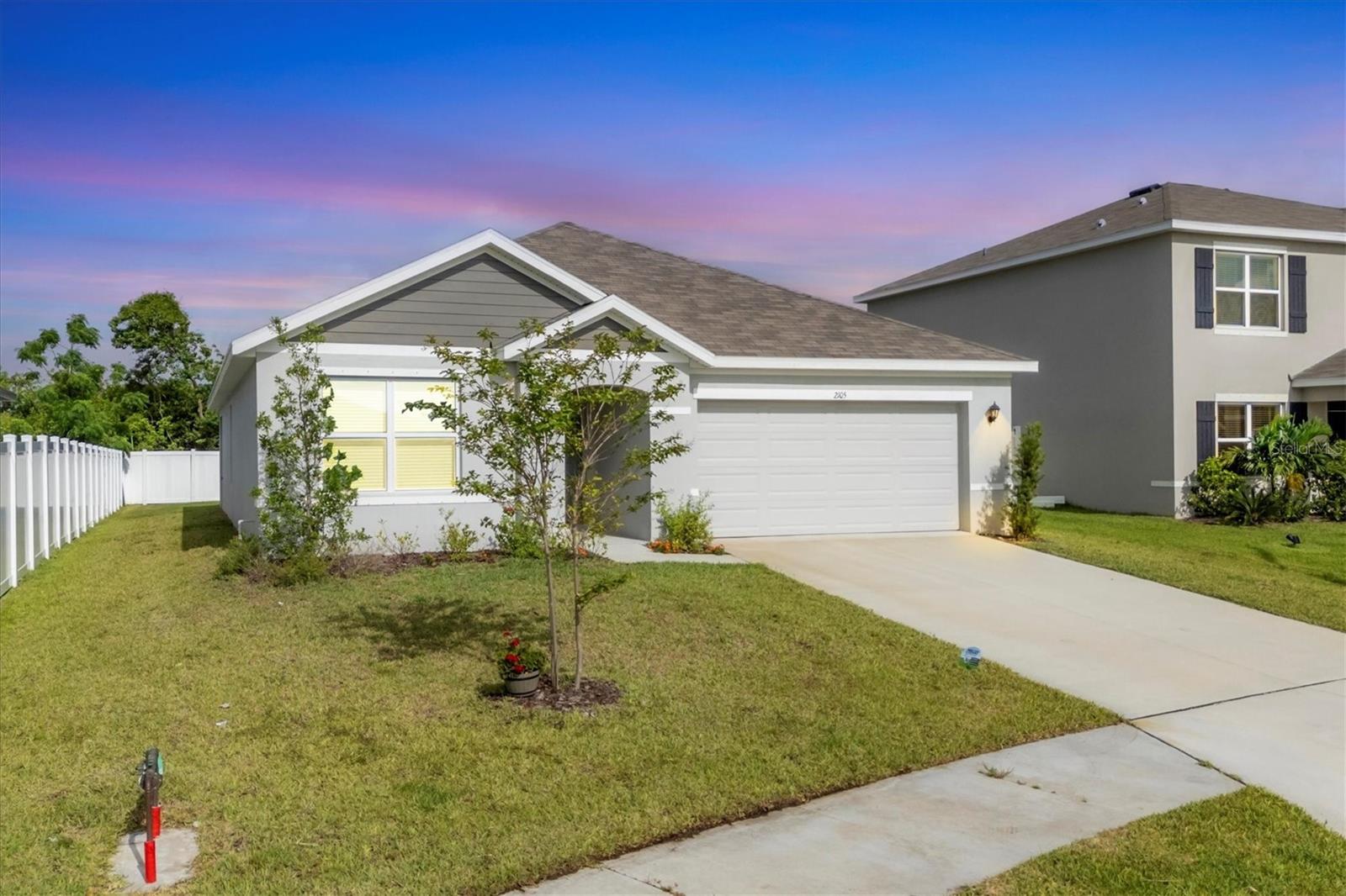 ~ Come experience living in The Villages of Glen Creek ~ This home featuring the ARIA floor plan model is practically brand new having been built just one year ago in 2024.  This SMART enabled home affords you the luxury of controlling lights, adjusting the thermostat temperature and opening garage doors and your front door all from the convenience of your phone.  Arrive at the gated entrance to an age and pet friendly development surrounded by a beautifully maintained, manicured and fenced community perimeter.  Step inside and you'll find a split bedroom floor plan offering privacy that has maximized space with an open layout tying the Dining Room, Kitchen and Great Room together. The flooring features easy maintenance ceramic tile in the main living areas with soft carpeting in the bedrooms for comfort underfoot. This home checks all the boxes for even the most discerning of buyers with its newer construction and appliances. The Primary Suite, which is very well sized, overlooks the privately fenced in backyard and is complete with a walk-in closet and a large bathroom area that includes a tiled walk-in shower and linen closet.  The kitchen, which is the true heart of this home, ties the main living areas together where you'll find granite countertops, stainless steel appliances, wood cabinets, a very large counter space that also accommodates barstool seating which will be just perfect when entertaining, a large closet pantry and a generous amount of cabinets for your storage needs.  Living in an X non-flood zone represents savings for you on your homeowner's insurance costs along with peace of mind. The front yard is serviced by a sprinkler system sourced from the community pond.  Hurricane shutters, which have never needed to be used, are included.  A PVC privacy fence encloses the backyard offering a safe private sanctuary perfect for your weekend bbq's and romping playground for your little ones and pets in addition to a covered patio area to escape from on those warmer summer days.  The reasonable $275/quarterly fees include high speed internet, a Clubhouse, a resort style swimming pool to indulge and relax in, a playground and a dog park. A Spectrum TV subscription with a plethora of channels and streaming apps is covered under the HOA fees in addition to Spectrum internet service. This affordable home is a true gem that has been maintained in excellent condition!