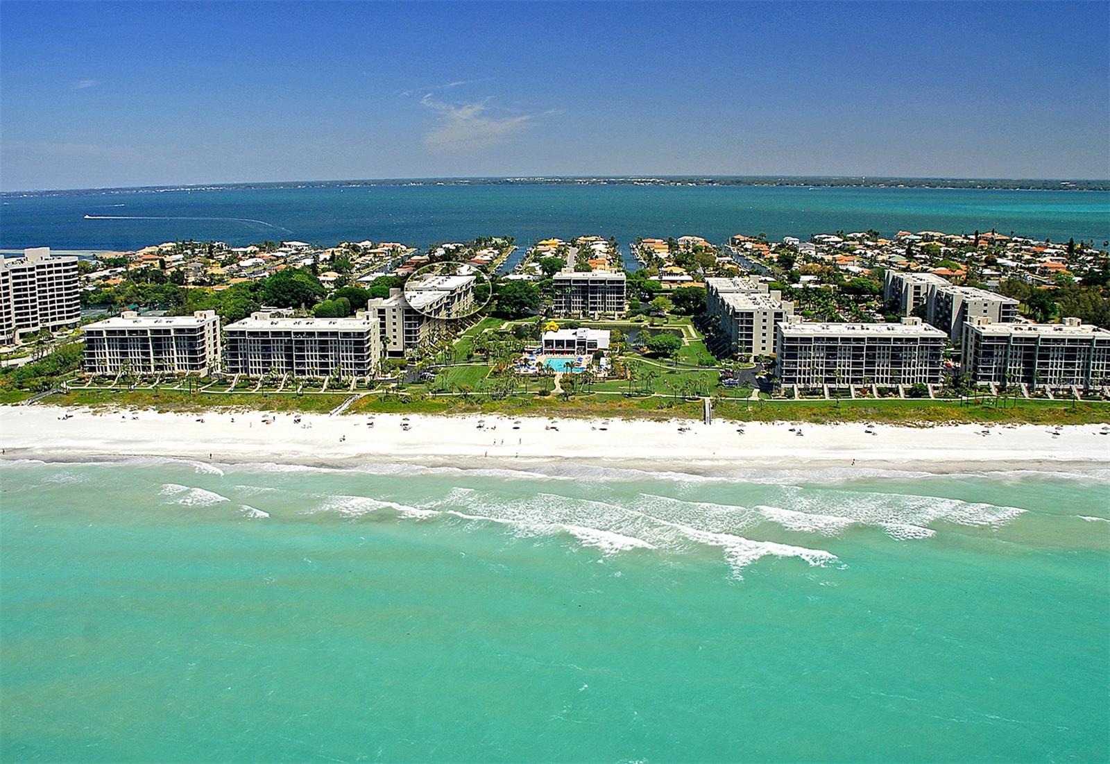 The  perfect beach getaway or investment property, look no further. With stunning water views from all new windows and doors, beach access, and appealing lease policy, this 1,172 square-foot 2 bedroom, 2 bath residence in Beachplace is ready to enjoy! Watch stunning sunset views from your southwestern facing, L shaped balcony overlooking beautiful well-manicured lawn, pond, and enchanting  Gulf of Mexico waters. This views can also be enjoyed while in the master bedroom. The condo residence is a corner unit, located on the 4th floor with ideal proximity to the building elevator and has wood-look tile throughout. Beachplace is perfectly located on the south end of Longboat Key, minutes from St. Armands, downtown Sarasota, SRQ Airport and much, much more. Community offers on-site management, 24-hour security, a Jr. Olympic-sized swimming pool, and newly designed hot tub area. There are lighted tennis courts, a fitness center and gas grills for the community use.