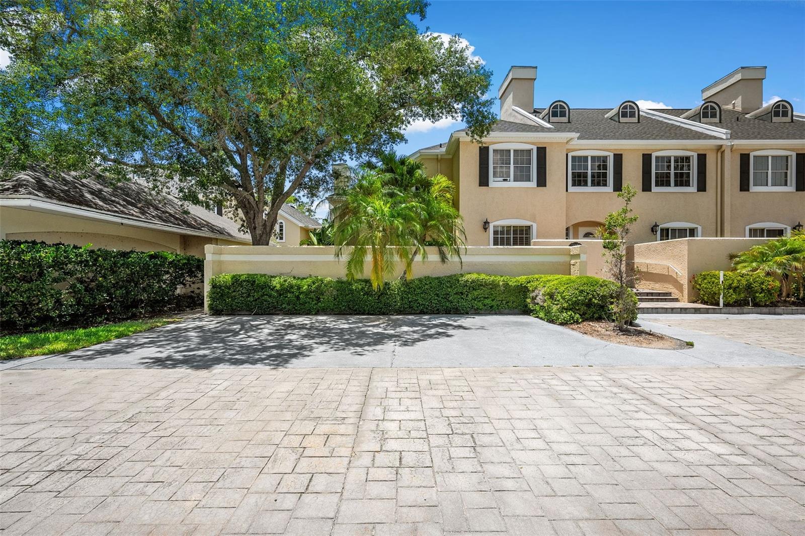 Experience the ultimate Florida Lifestyle in this amazing and spacious 3-bedroom, 3-full-bath Clearwater end-unit Townhome! Boasting dramatic vaulted ceilings and floor-to-ceiling windows, this home features UPDATED KITCHEN & BATHS with STAINLESS STEEL appliances. The highly desirable layout includes a convenient BEDROOM AND FULL BATH ON FIRST FLOOR, great flexibility for guests and multigenerational living. The second floor features the Primary and Secondary Bedrooms EACH WITH PRIVATE ENSUITE BATHROOMS. Relax on the large, enclosed back patio lanai offering serene POND WATER VIEWS AND TROPICAL LUSH NATURE VIEWS. A detached TWO CAR GARAGE provides abundant extra storage for golf clubs and water gear. Perfectly situated across from the Feather Sound Golf Club and Bay bridges, this location is a dream for golfers and water enthusiasts alike. Enjoy an effortless commute to downtown Tampa, world-class Gulf beaches, and both major airports. Whether you're a local or looking for the perfect out-of-state escape, this turnkey home has it all!
** Highlights For Quick Reference:  
• Bed/Bath Setup: 3 BD / 3 BA (1 Bed/1 Bath on 1st Floor; 2 En-Suites on 2nd Floor)
• Flooring: Hard Surface Flooring 
• Outdoor Living: Large Enclosed Lanai with Water & Tropical Views
• Parking/Storage: Detached 2-Car Garage
• Location: Minutes to Feather Sound Golf, Tampa Bay Bridges, Beaches, & 2 International Airports