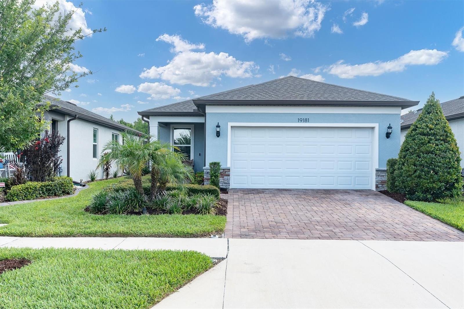 Welcome to effortless resort-style living in Del Webb Bexley, one of Tampa Bay's premier gated 55+ active adult communities. Built in 2022, this beautifully maintained Contour floorplan offers 2 bedrooms, 2 bathrooms, a private flex room with custom French doors, and 1,400 square feet of thoughtfully designed living space tucked away on a quiet cul-de-sac homesite.
From the moment you enter, you'll appreciate the bright, open-concept layout featuring luxury vinyl plank flooring throughout the main living areas, kitchen, and flex room, porcelain tile in the bathrooms, and plush carpeting in the bedrooms. At the center of the home, the beautifully appointed kitchen combines style and functionality with quartz countertops, a spacious island ideal for casual dining and entertaining, Whirlpool stainless steel appliances, a gas range, 42" solid wood upper cabinets, soft-close drawers, and generous storage throughout. The open layout keeps everyone connected, making it just as practical for everyday living as it is for hosting family and friends.
The spacious primary suite offers a relaxing retreat, complete with a custom-designed walk-in closet and an ensuite bath featuring dual vanities and quartz countertops. The secondary bedroom also includes a custom closet system, providing exceptional organization and functionality for guests or seasonal residents. The flex room with custom French doors offers the perfect space for a home office, hobby room, reading nook, or additional guest accommodations.
Enjoy Florida living year-round from the screened lanai featuring custom shades for added privacy and comfort. Additional upgrades include a TB Platinum water softening system, gas tankless water heater, pull-down attic access for additional storage, garage wall-mounted storage shelving, upgraded laundry room cabinetry, Whirlpool washer and dryer, and a Synergy Home system.
Living in Del Webb Bexley means enjoying a truly maintenance-free lifestyle. The HOA includes lawn maintenance, irrigation, cable, internet, and access to an impressive collection of resort-style amenities. Residents enjoy the Meridian Clubhouse, resort and resistance pools, fitness center, pickleball and tennis courts, bocce ball, walking trails, dog park, social clubs, and a full calendar of community events. Golf carts are welcome, making it easy to explore everything this vibrant community has available for its resident to enjoy.
Ideally located in the heart of Land O' Lakes, Del Webb Bexley offers convenient access to the Veterans Expressway, Tampa International Airport, downtown Tampa, world-class Gulf beaches, championship golf courses, medical facilities, shopping, dining, and the popular Bexley Hub. Whether you're looking for an active lifestyle, a lock-and-leave seasonal residence, or a low-maintenance home base close everything in Tampa Bay, this move-in ready home checks all the boxes.
Loaded with thoughtful upgrades and move-in ready, this exceptional home offers the perfect blend of comfort, convenience, and resort-style living in one of Tampa Bay's most sought-after active adult communities.
