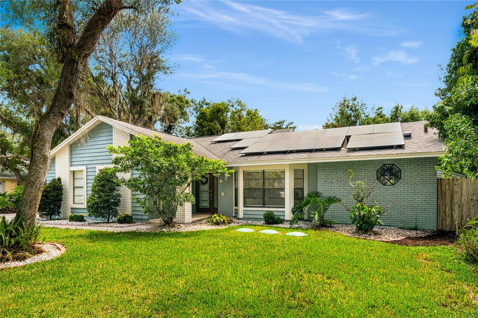 TRUE OASIS POOL HOME WITH WEKIWA SPRINGS STATE PARK IN YOUR BACKYARD.  Thoughtfully renovated with attention to detail in every decision made by the owner. Stylish barn door conceals a front office/den/bedroom welcoming you into this CONCRETE-BLOCK home. Focal point is a re-imagined kitchen highlighted by a center island, topped with natural live-edge wood counter surface.  Smart double-oven, induction cooktop w/hood, tiled wall with wood shelving, farmhouse-sink, champagne-bronze finishes, quartz countertop, large pantry, wine-fridge, stainless appliances, breakfast bar, and built-in seated dining area with paneled ceiling & wood beam accent make this a space you will never want to leave.
The primary bedroom renovation creates a sanctuary with high ceilings, a wood shiplap feature wall, sliding privacy door separating an updated bathroom complete with dual-vanities, floor-to-ceiling tiled shower with multiple shower heads (decorative inlay & foot-rest for smoothly shaved legs!) and walk-in closet create an environment worth getting out of bed for!
Family room with wood-burning fireplace and architectural feature wall offer an entertaining environment for residents and guests alike.  Two generous guest bedrooms and a fully updated spare bathroom attend to the needs of everyone.  Outside, enjoy year-round living on the large covered lanai while cooling off in the oversized swimming pool with abundant decking under the screened enclosure.  
OTHER UPGRADES INCLUDE: ROOF (2019), HVAC (2019), REPIPE (2022), HWH (2022), ELECTRIC PANELS (2020/22), Smart-Home Systems throughout, New Waste-Water Treatment System (2025), Paid-Off Solar System (2022), Built-In Closets, Updated Lighting/Outlets/Switches, Outdoor Shower (2022), DUAL Washer/Dryer Hookups, Generator Hook-Up (2025), 220v Hot-Tub Sub-Panel (2022). Laundry room was brought under air adding an additional 100sf of living space.
The Wekiva Glen neighborhood is tucked into the Wekiwa Springs State Park.  Boasting a gated entrance, tree-lined streets, community sport courts and playground, you will love living here!  Property backs to the beauty and privacy of Wekiwa Springs State Park and full privileges to the park’s abundant amenities are conveniently available.