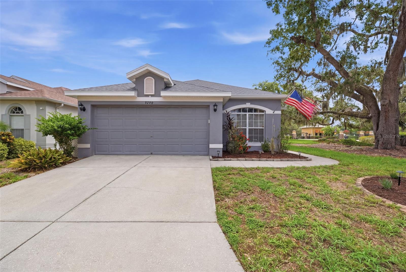 Gorgeous gem of a home!! Located in the sought-after gated community of Water's Edge. This 4 bedroom, 2 bath, 2 car garage sits on a prime CORNER lot. The open floor concept has the family room, kitchen and dining areas located together with a separate formal living room. Perfect for entertaining and those large family gatherings. The kitchen is the heart of this home, newer stainless-steal appliances, solid surface counters, a massive center island and oversized pantry. This area of the home overlooks and leads out to the covered screened porch and PRIVATE vinyl fenced yard. Bedrooms are spaced well for privacy with a primary suite that has it all... a spa-like feel with dual sinks, garden tub, stand-up shower and walk-in closet. The 4th bedroom has a double door entry, great for a home office, nursery, etc. NEW ROOF 2024! A/C handler 2025! This community comes with a very active clubhouse, fitness center and multi-sports court. Also, a resort style community pool with kids splash pad that you and your family will enjoy! Don't forget about the beautiful spring fed lake with two docs, a fishing pier and boat launch. So, bring your kayaks and canoes to further enjoy this beautiful place you can call home. LOW HOA fees of $169.00 monthly that also includes security, internet, cable, irrigation and trash. Yearly CDD fee of $1284.37 is already included in tax bill. Due to Pasco's new road infrastructure, "Historic downtown" New Port Richey, Suncoast Parkway, Tampa International and some of Florida's most popular parks and beaches are just minutes away. Call to set up your private showing today!