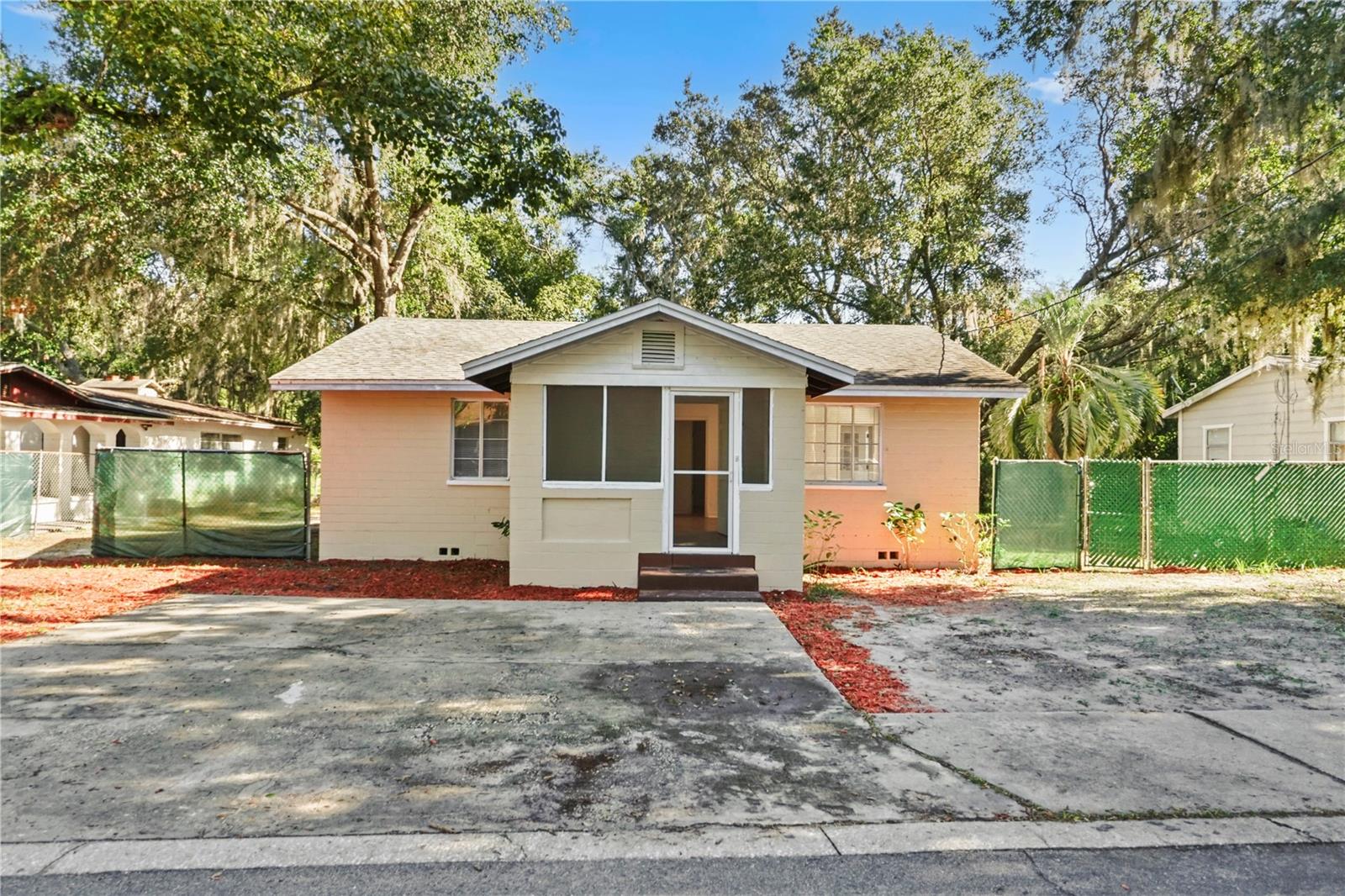 Can move in fast. This recently renovated 3-bedroom, 2-bath home at 1730 N Orange Street delivers space, flexibility, and location—an ideal combination for both homeowners and investors. Inside, the primary suite features large-format marble-look tile and a beautifully updated en-suite bath, complemented by a second newly tiled bathroom and a bright, welcoming screened-in front porch that expands your living space. The kitchen is finished with granite countertops, solid wood cabinetry, and stainless-steel appliances, offering durability and everyday functionality. Step outside and the opportunity really opens up: the huge fully fenced backyard spans approximately 10,125 square feet (81' x 125'), providing ample room to store a multitude of items such as boats, trailers, work equipment, recreational vehicles, or additional vehicles, while still leaving space for pets to roam freely. With room to park more than four cars out front and potential for future development or expansion, the lot offers rare flexibility. Located in a quiet area with friendly neighbors, this home is just minutes from the charm and energy of downtown Mount Dora, known for its year-round city festivals, art shows, craft fairs, food events, and lakeside atmosphere along Lake Dora. Whether you’re looking for a move-in-ready home, a property with storage and flexibility, or a smart long-term investment in one of Central Florida’s most beloved towns, this one checks all the boxes.