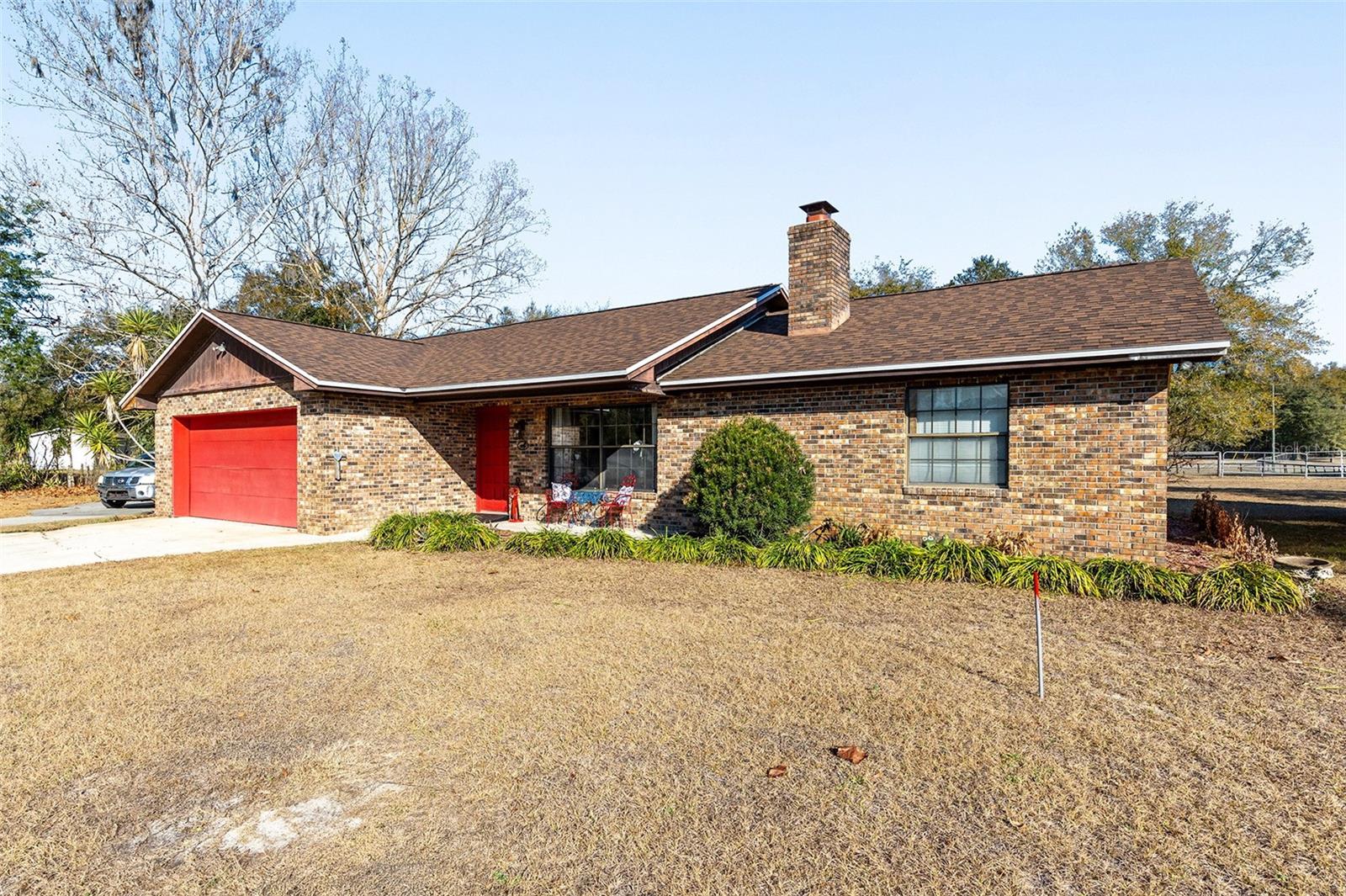 Experience the perfect combination of comfort, space, and rural charm with this well-maintained 3-bedroom, 2-bathroom brick home situated on 3.21 acres in the peaceful community of Citra. Ideal for those seeking a private homestead, hobby farm, or equestrian-friendly property, this residence offers both functionality and timeless appeal. Located close to Majestic Oaks Equestrian Center. The RV in the photos has been removed.
The home features a practical layout with bright, open living spaces and durable brick construction designed for low maintenance. Two well-appointed bathrooms provide convenience for family and guests, while the overall floor plan supports both everyday living and entertaining.
Outdoors, the acreage is thoughtfully arranged with open pasture accented by mature trees, creating a scenic and usable landscape. Horse enthusiasts will appreciate the two-stall barn, offering space for animals, equipment, or additional storage. With ample room to expand, garden, or simply enjoy the quiet surroundings, this property presents a wide range of possibilities.
Conveniently located between Ocala and Gainesville, this mini farm offers the tranquility of country living with easy access to The World Equestrian Center and other nearby amenities, services, and commuter routes.
New roof in Nov 2024