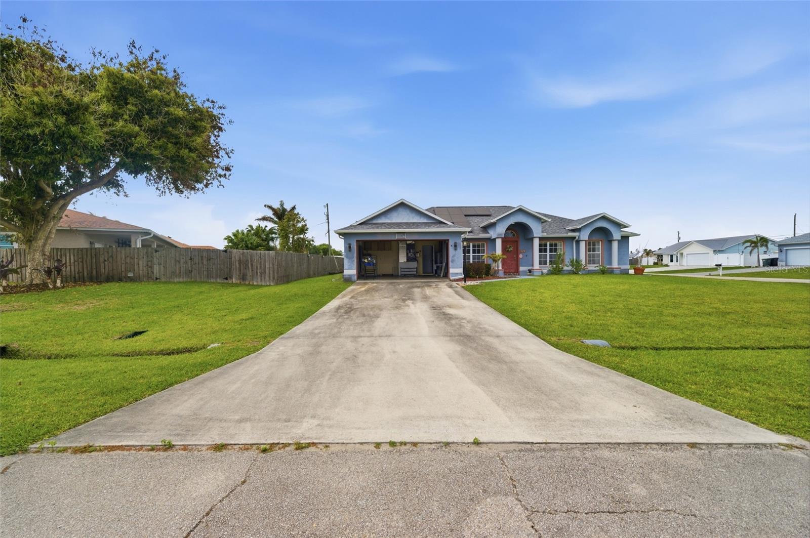 Short Sale. Welcome to this beautifully maintained 3-bedroom, 2-bathroom home situated on an oversized corner lot of over a quarter acre in desirable Port St. Lucie—with no HOA restrictions!

This thoughtfully upgraded home offers peace of mind with a new roof, new A/C, and fully paid-off solar panels installed in 2022, providing energy efficiency and long-term savings. Inside, you’ll find stylish wood-look laminate flooring flowing throughout the main living spaces, complemented by architectural columns, decorative cut-outs, and an abundance of natural light from large windows.

The spacious layout features a formal dining room and an expansive living room with sliding glass doors that open to a screened-in rear porch—perfect for relaxing or entertaining while overlooking the generously sized backyard.

The kitchen is a standout, equipped with stainless steel appliances, a mosaic tile backsplash, recessed lighting, and a large island with seating. A sizable closet pantry provides ample storage for all your culinary needs.

The primary suite offers a private retreat with an ensuite bathroom featuring dual sinks, a Roman tub, and a separate shower. The additional bedrooms also include matching laminate flooring and ceiling fans for comfort and style. The second bathroom has been tastefully remodeled with a modern shower and updated vanity.

Additional features include a separate laundry room, a two-car garage, and an extended driveway with plenty of room for multiple vehicles, boats, or recreational toys.

Conveniently located near Interstate 95, this home offers easy access to shopping, including Publix and Walmart Supercenter, as well as dining, entertainment, and events at Tradition Village Center. Enjoy outdoor adventures just a short drive away at Savannas Preserve State Park or relax on the nearby beaches.

This move-in-ready home combines comfort, style, and convenience—schedule your private showing today!
