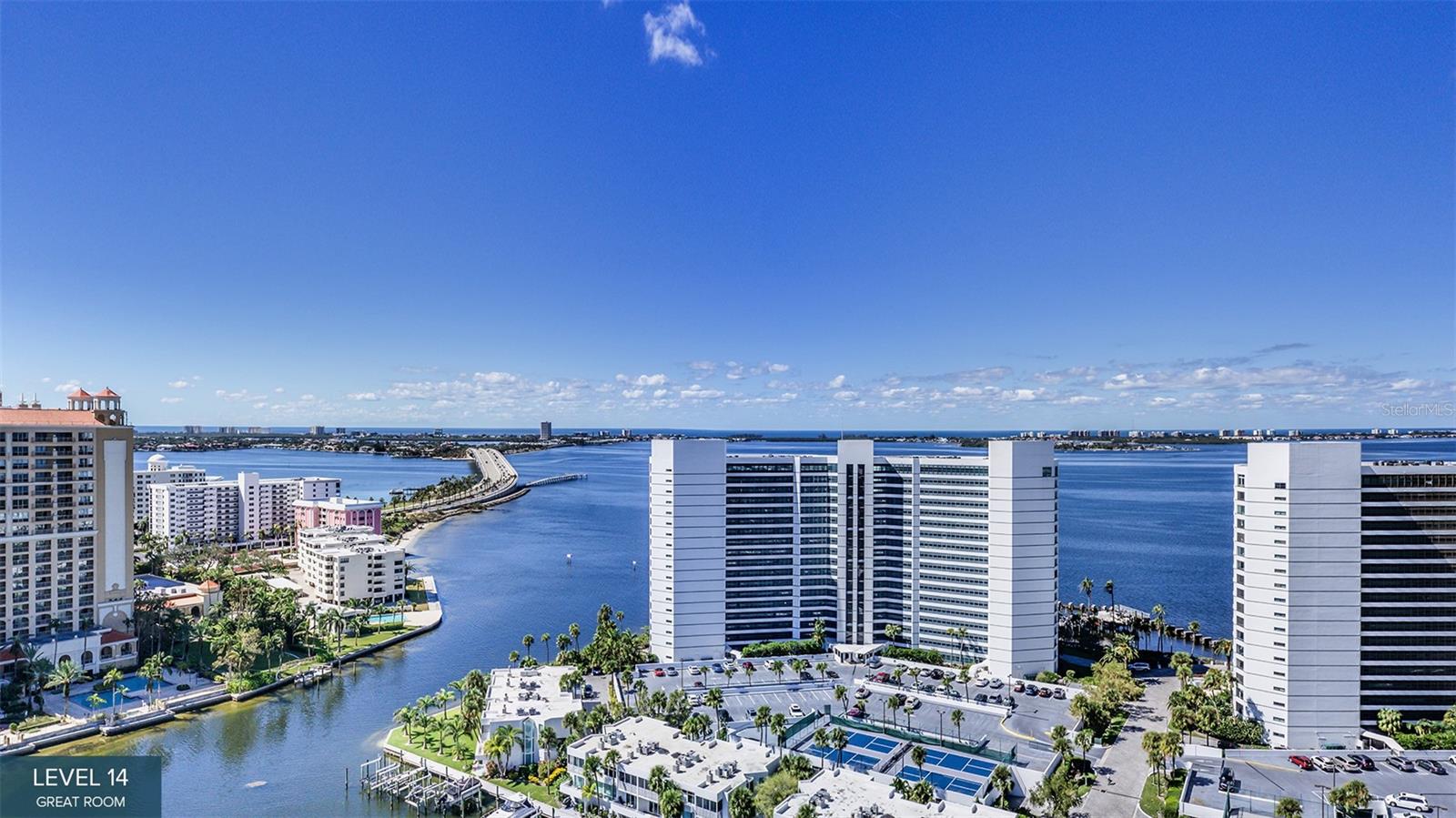 One or more photo(s) has been virtually staged. Residence #1402 showcases sweeping sunset views over Sarasota Bay from the 14th floor of The Ritz-Carlton Residences. This southwest-facing Residence B floor plan is filled with natural light, with the great room, dining area and private terrace all oriented to capture panoramic water views. The open kitchen with breakfast bar flows seamlessly for everyday living and entertaining. The primary suite offers terrace access, dual walk-in closets, and a spa-inspired bath with soaking tub and walk-in shower. Two guest suites with en-suite baths share a separate sunrise-facing terrace, while a private den provides flexible space for work or retreat. Residents enjoy 24-hour concierge and valet, in-residence dining, housekeeping services, and a remarkable collection of private amenities overlooking the yacht harbor, plus access to The Harbor Club’s nearly 20,000 square feet dedicated to wellness and social spaces. Beyond the views and finishes, what distinguishes this opportunity is the protection of the brand. The Ritz-Carlton standards are more than a name, they are a long-term commitment to excellence, service and meticulous oversight. That commitment safeguards your investment and preserves the integrity of your home. With limited residences remaining, now is time to secure the one that aligns with you.