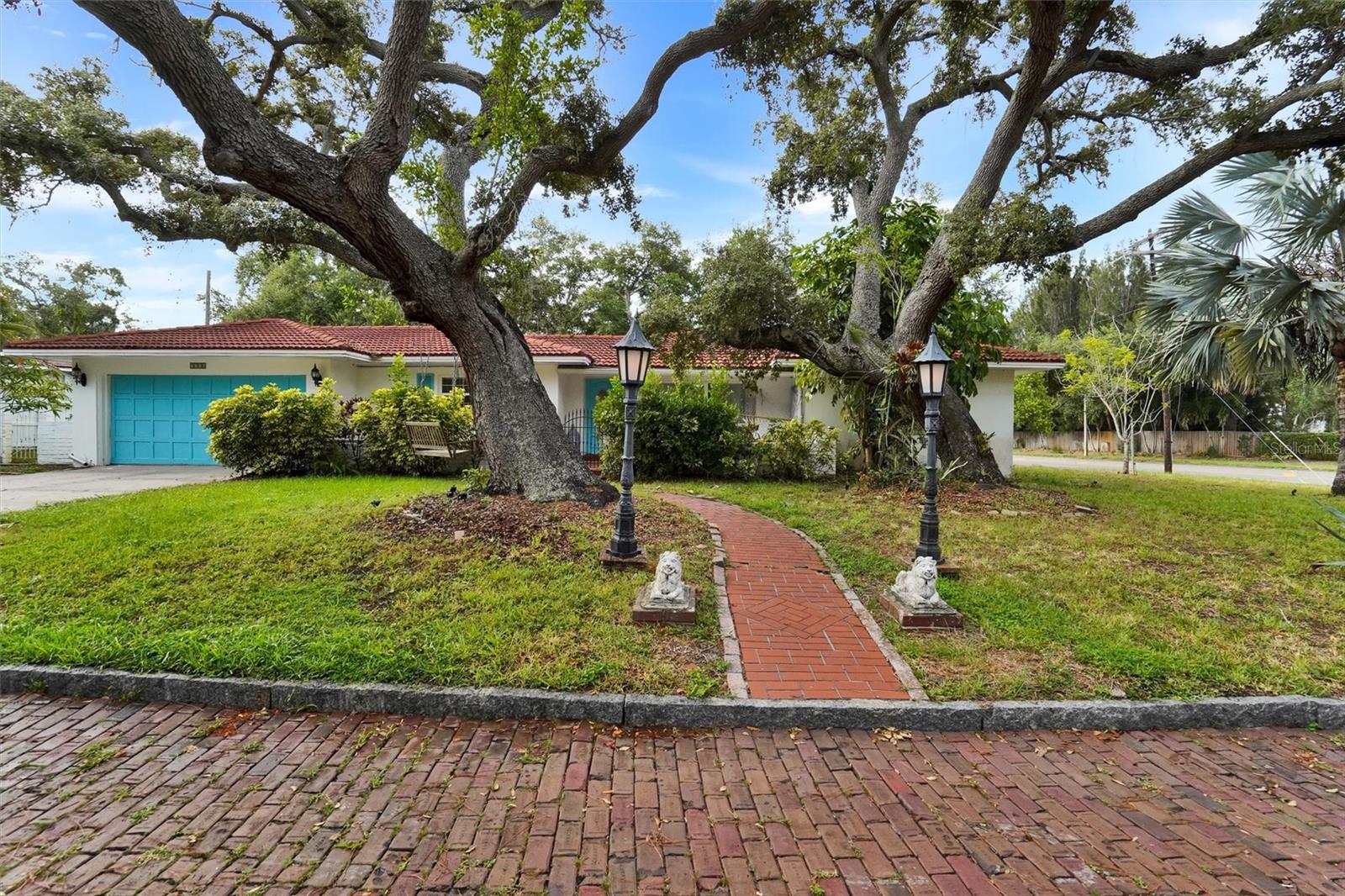 Renovated Coastal Gem on an Oversized Corner Lot With Pool, Sunroom & Architectural Expansion Plans Included Welcome to 7716 Dartmouth Avenue N—an exceptional opportunity to own a beautifully renovated three-bedroom, two-bath home on a rare oversized corner lot in one of St. Pete’s most peaceful, tree-lined neighborhoods. Perfectly positioned just minutes from Treasure Island’s shoreline, the Pinellas Trail, downtown St. Petersburg, and top-rated Admiral Farragut Academy, this home brings together coastal convenience, charm, and modern comfort. Step inside to find a bright, inviting interior with two working fireplaces, a stunning modern kitchen, fully renovated bathrooms, and a spacious layout designed for both everyday living and relaxed Florida entertaining. A charming sunroom—flooded with natural light—offers the perfect backdrop for morning coffee, creative work, or indoor/outdoor lounging. Out back, your private oasis awaits: a screened-in pool, expansive fenced yard, mature landscaping, and abundant room for outdoor dining, gardening, pets, or recreational space. The two-car garage and large corner-lot footprint provide excellent parking options and added privacy. This exceptional property also comes with architectural plans for a future addition, giving you the rare opportunity to expand and elevate the home to match the multi-million-dollar estates located just across the street. Whether you envision a luxurious primary suite, guest wing, or larger living and entertainment spaces, the groundwork has already been laid. Ideal as a primary residence, second home, or investment, this turnkey property offers quiet tranquility with unbeatable proximity to beaches, parks, cultural attractions, dining, transportation, and the best of Florida’s Gulf Coast lifestyle. Highlights: •Oversized, private corner lot •Screened-in pool & beautiful fenced yard •Fully renovated interior with modern finishes •3 bedrooms, 2 full baths •New kitchen & upgraded systems •Two working fireplaces •Light-filled sunroom •Two-car garage & ample parking •Quiet, peaceful block with excellent walkability •Minutes to Clearwater, Treasure Island, downtown St. Pete, and major attractions • Steps from Admiral Farragut Academy • Includes architectural plans for a future addition •Exceptional opportunity for owner-occupants, or investors