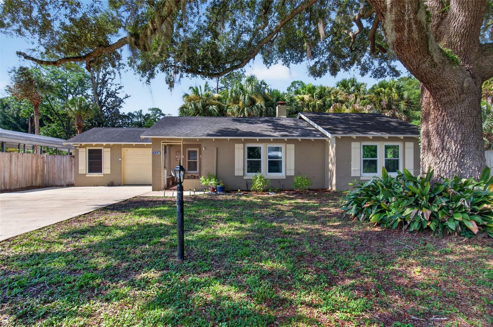 Welcome to this move-in ready corner lot centrally located in Gainesville 1.7 miles from UF. Whether you're looking for a primary residence, investment property, or the perfect blend of both, this 3 bed/1 bath home checks every box. Step inside and discover a home that has been thoughtfully updated for peace of mind. The home features new windows (2022), new HVAC (2024), new water heater (2024), new exterior doors (2025), new plumbing (2026), new washer/dryer, gas stove, and dishwasher (2025), and partially remodeled kitchen with butcher block counters (2026). The yard is a true retreat with a a majestic mature oak tree, while lush palm trees create a serene, almost tropical atmosphere over the paved patio. The outdoor shower adds a fun, Florida-lifestyle touch. The location is highly desirable and convenient. Walk or bike to grocery stores, coffee shops, UF and the vibrant energy of Downtown Gainesville all just minutes from your front door. Updates this good, in a location this central, won't last long.