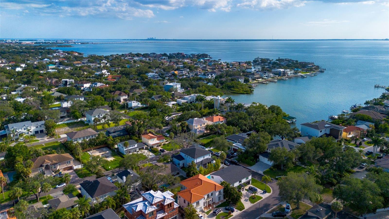 Set in the prestigious Sunset Park neighborhood, this exceptional residence presents a rare opportunity to own a completely reimagined home in one of South Tampa’s most desirable enclaves. Surrounded by luxury estates and ideally positioned near Tampa’s finest amenities, this meticulously renovated pool home offers a seamless blend of timeless sophistication, modern design, and everyday functionality.
Thoughtfully rebuilt from the studs with an uncompromising commitment to quality, the two-story residence showcases elevated finishes and refined craftsmanship throughout. Natural light pours through energy-efficient double-pane insulated windows, illuminating expansive living spaces adorned with oversized 24” x 48” porcelain tile, substantial 5¼” wood trim, contemporary wire railings, and a striking glass-paneled entry door.
At the center of the home, the designer kitchen serves as both a culinary workspace and gathering place. Custom 42-inch soft-close cabinetry in a sophisticated Cyber Gray palette is complemented by oversized gold hardware and luxurious 1¼-inch quartz surfaces, including dramatic waterfall-edge detailing. A carefully curated appliance package includes double wall ovens, a dedicated cooktop, vent hood, dishwasher, refrigerator, and a built-in dual-zone wine refrigerator, creating an environment equally suited for intimate evenings or large-scale entertaining.
The residence offers three bedrooms and two-and-a-half beautifully appointed baths. Upstairs, the private primary suite serves as a serene retreat, while two additional guest bedrooms and fully renovated baths continue the home’s cohesive design aesthetic. A thoughtfully placed powder room on the main level provides convenience for guests.
Designed to embrace Florida’s indoor-outdoor lifestyle, the backyard is a private sanctuary featuring a sparkling pool, refreshed and beautifully maintained, surrounded by sealed pavers and lush new landscaping. Whether hosting gatherings or enjoying quiet evenings at home, the outdoor setting delivers both privacy and elegance.
Additional improvements include a newer roof (2021), new irrigation system, upgraded pool finishes, fresh sod, and extensive exterior enhancements that contribute to the home's impressive curb appeal.
Located within the highly acclaimed Plant High School district and zoned for A-rated Dale Mabry Elementary and Coleman Middle School, this residence offers unparalleled access to Tampa International Airport, Downtown Tampa, Tampa General Hospital, premier shopping and dining destinations, and the Gulf Coast's renowned beaches.
A rare offering in Sunset Park, this turnkey residence embodies modern luxury, exceptional craftsmanship, and an enviable South Tampa lifestyle.