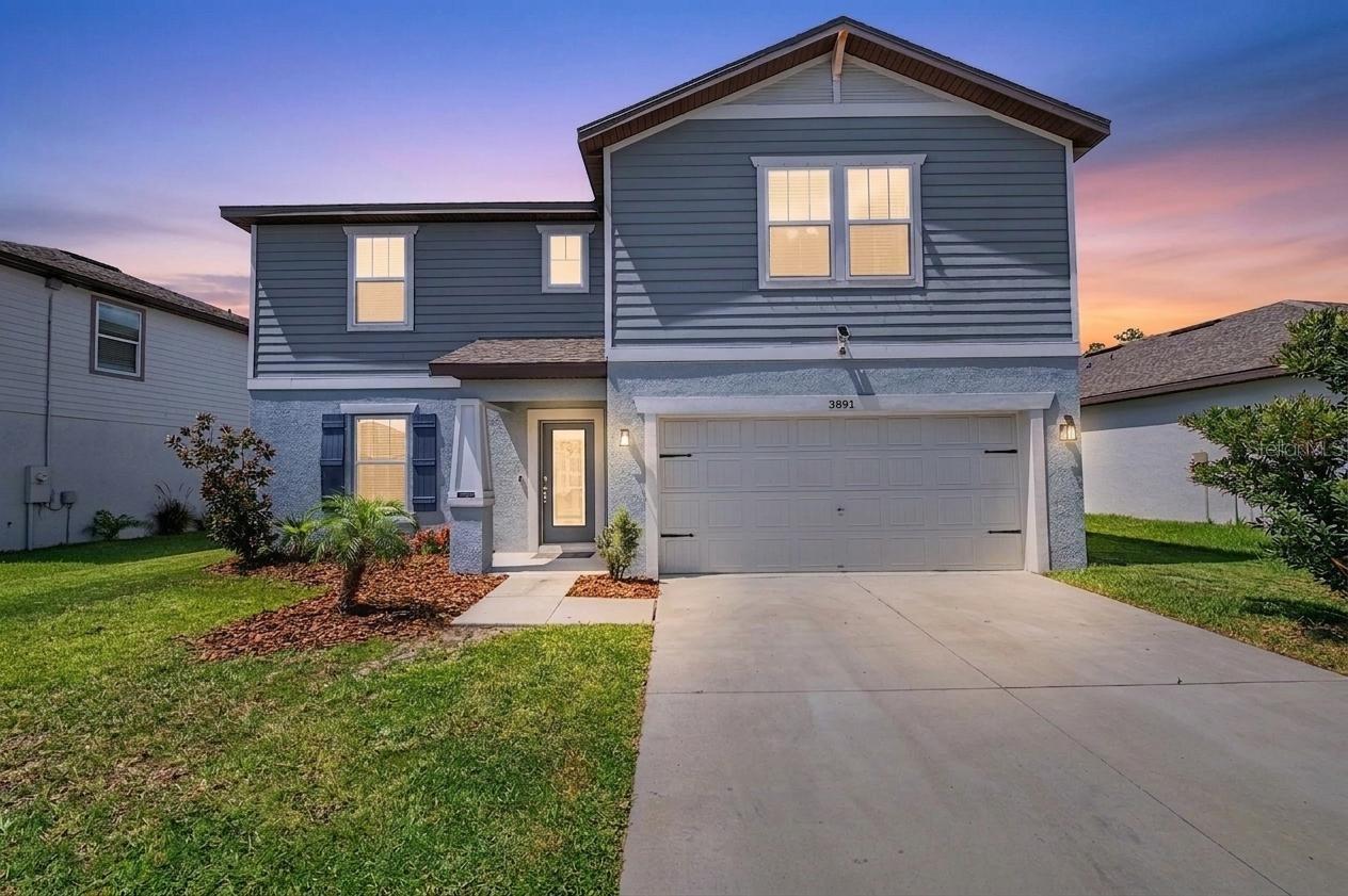 Built in 2023, this spacious 4-bedroom, 3.5-bath home offers nearly 2,900 square feet of thoughtfully designed living space, a pond view, an open floor plan, and a beautifully appointed kitchen with granite countertops, a large island, and a walk-in pantry. Located in the desirable North Park Isle community, this two-story home provides the perfect blend of comfort and functionality.

The open-concept kitchen overlooks the family room, creating an ideal space for everyday living and entertaining. The primary suite is conveniently located on the main floor and features a walk-in closet and a private en-suite bath. Upstairs, additional bedrooms and flexible living space provide room for family, guests, or a home office.

Enjoy Florida living from the backyard featuring a fire pit, patio, and peaceful pond views. Additional highlights include hurricane shutters, a tankless water heater, irrigation system, outdoor grill, balcony, sliding glass doors, and an attached two-car garage.

North Park Isle residents enjoy access to community amenities including water access and a dock while being conveniently located near shopping, dining, schools, and major roadways for an easy commute throughout the Tampa Bay area.

Schedule your private showing today to experience everything this exceptional home has to offer.
