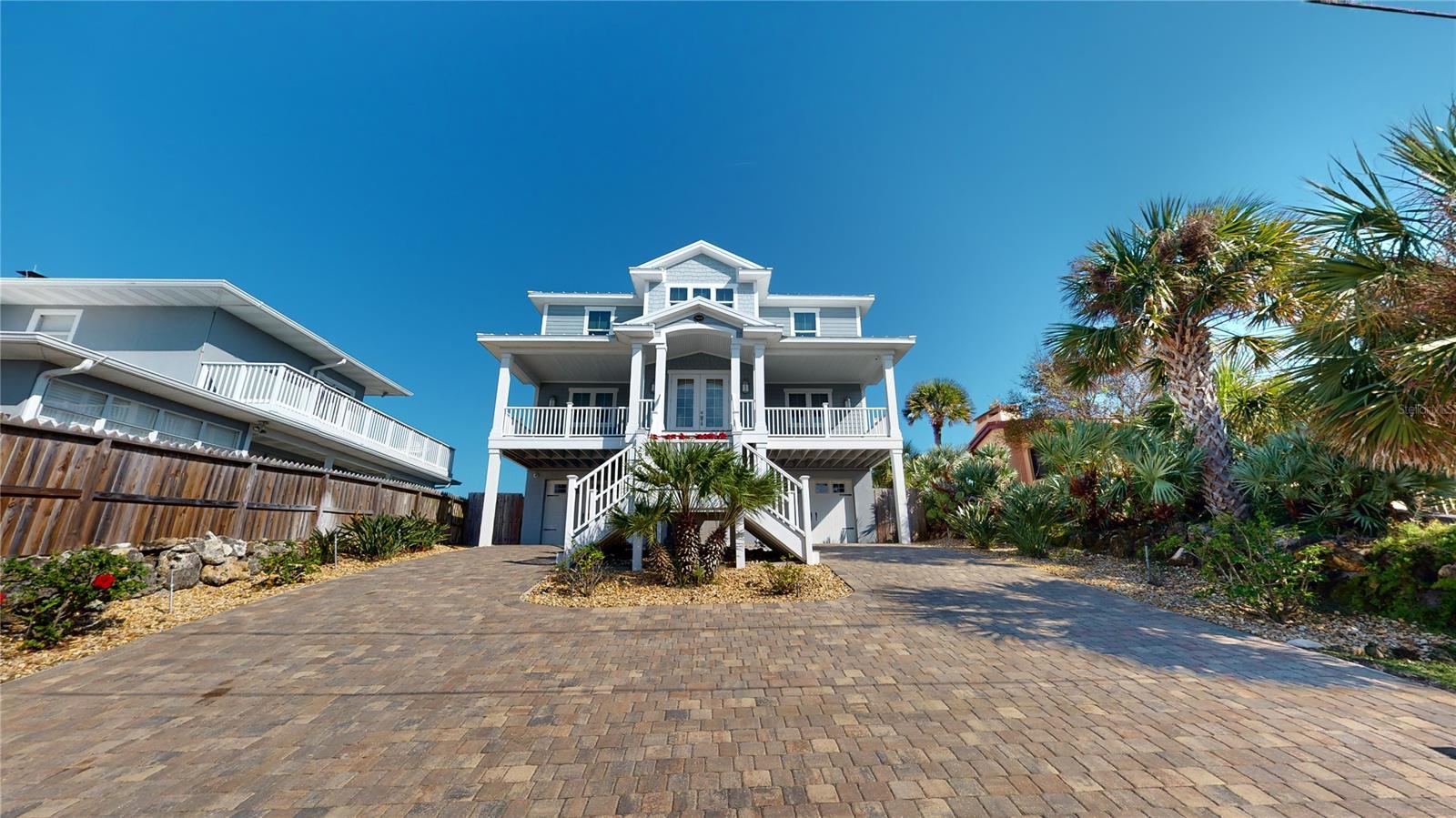 Mornings first glimpse of sunrise from your ocean front balcony promises for another day in paradise. A cup of coffee and making plans for the first day of the rest of your life knowing your dream home belongs to you. This can be you and yours available in a luxury home located directly on the Atlantic Ocean. Positioned on an elevated lot giving spectacular views of mother nature's bounty.
This luxury property is a must see, you will immediately fall in love. On those nippy fall and winter mornings warm up next to your gas fireplace. As the day warms head out to the beach for a jog or walk or even better a bike ride.  Perfect days await you!  Additional features include a 932 sf. finished garage with epoxy coated floor, as well as a complete workshop and mudroom for rainy days and muddy dogs. After a long day at the beach take your private elevator to the living quarters. Kitchen features top brand appliances under counter wine cooler, granite counter tops and special under sink water heater for dishwasher. Home also features a 20kw generator which activates as a result of loss of power. More luxury features are solar shades; new outdoor compressors with an additional protective coating to protect from the elements. As a final touch, the home is constructed twenty three feet above sea level. Reference Documents for survey. ;Water: City