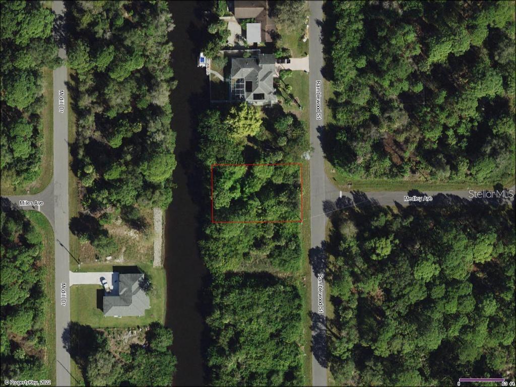 Sensational and Vacant Waterfront Lot in Port Charlotte! Conveniently situated in a highly sought-after community near tons of desirable amenities, this large 10,000sqft (0.2296-acres) lot offers a tremendous opportunity to live the Floridian dream. Boasting access to the Myakka River, the lot is perfect for those seeking nautical adventures and enjoyable weekend fishing trips. Build the home of your dreams with stunning tropical landscaping, solid concrete block construction, a 3-car garage, premium interior finishes, a private split-floorplan, and an exquisite primary suite. Located less than 5-miles from Warm Mineral Springs, you can take advantage of the health benefits of the mineral spring baths. If you prefer shopping excursions, the property is less than 11-miles for multiple shopping centers, trendy restaurants, and malls. Emanating cool coastal vibes, this well-appointed lot will go quickly.
