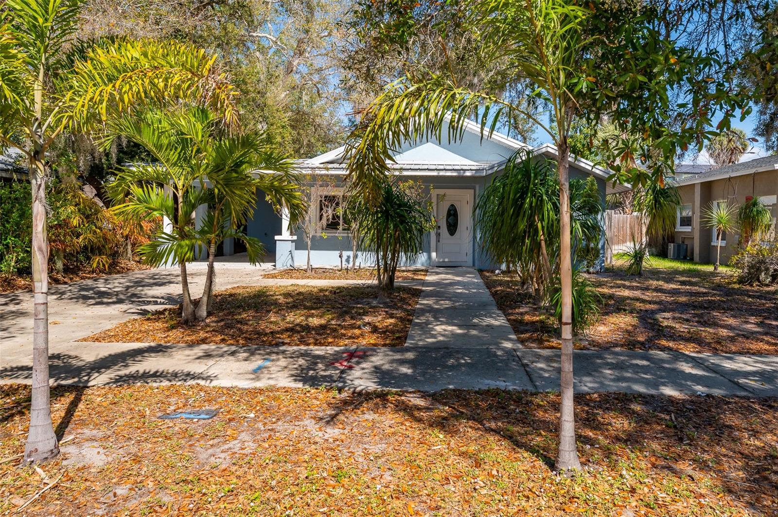 Completely rebuilt in 2017, this beautifully updated 3-bedroom, 2-bath home offers modern construction and thoughtful design throughout. Major improvements include new plumbing, updated electrical with a new meter, a new AC system with updated ductwork, a metal roof with new trusses, and modern windows for added efficiency and peace of mind. The single-story layout offers 1,513 sq ft of well-designed living space featuring tile flooring throughout, tray ceilings with integrated lighting, and a vaulted ceiling in the living room that creates a bright, open feel. The open-concept floor plan seamlessly connects the living, dining, and kitchen areas, ideal for entertaining and everyday living. An 8-foot sliding glass door opens to a covered porch and a large fenced backyard, creating an easy indoor-outdoor lifestyle. The kitchen features sleek countertops, modern cabinetry, and Whirlpool stainless steel appliances with ample counter space and storage. Bedrooms are spacious and filled with natural light. The primary suite includes a modern en-suite bath with dual sinks and a walk-in shower, while both bathrooms feature clean, contemporary finishes. The backyard offers plenty of room to add a pool and create your own private outdoor retreat. No HOA. The home can be sold furnished or unfurnished. Strong investment potential in a favorable short-term rental market, ideal for buyers seeking income opportunities. Conveniently located just minutes from the Ringling Museum, downtown Sarasota, St. Armands Circle, Sarasota-Bradenton International Airport, and the beaches of Lido Key and Longboat Key.