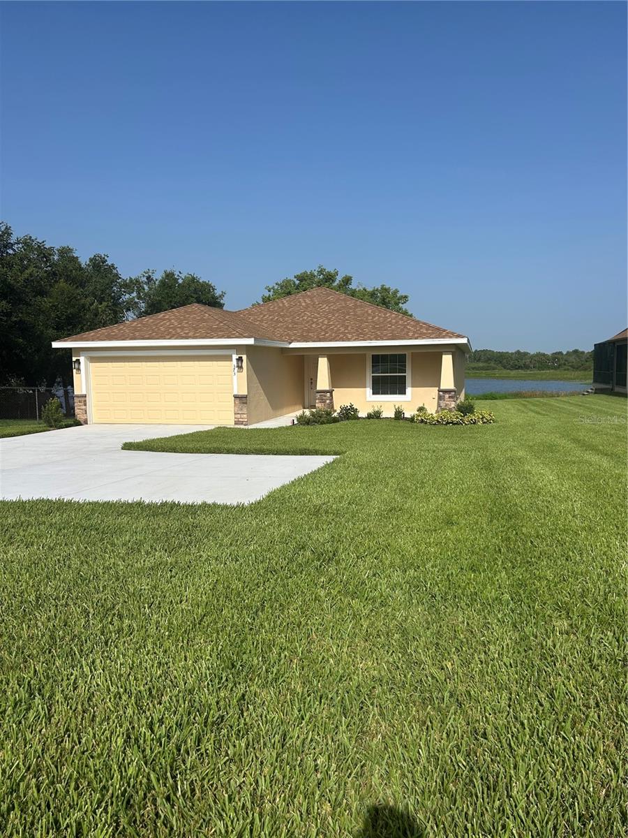 Brand New House with access to Lake Tracey. Located just one minute from Hwy 27 and approximately 16 minutes from 1-4. Restaurants grocery stores medical and dental facilities; schools and shopping are on your doorstep. The house comprises of 3 bedrooms and 2 bathrooms stunning kitchen with a uniquely oversized solid surface breakfast bar, walk in pantry inside laundry complimented by all new Stainless-Steel Appliances. Seamlessly transitioning into a large bright living room, illuminated by triple sliding glass doors which lead onto a covered and screened Lanai to enjoy the beautiful quiet, serene and peaceful Lake Tracey. Morning coffee or evening Sunsets, both equally appealing. A large master bedroom which also enjoys views of the lake, two large walk-in closets closets...one each, what could be better, a master bathroom with an exceptionally large fully tiled walk-in shower, and double vanities, it is bright inviting and functional. The property has a further two bedrooms serviced by an addition bathroom. Vinyl Plank flooring has been used throughout the property.  A very well thought out floorplan. Early viewing is highly recommended.
