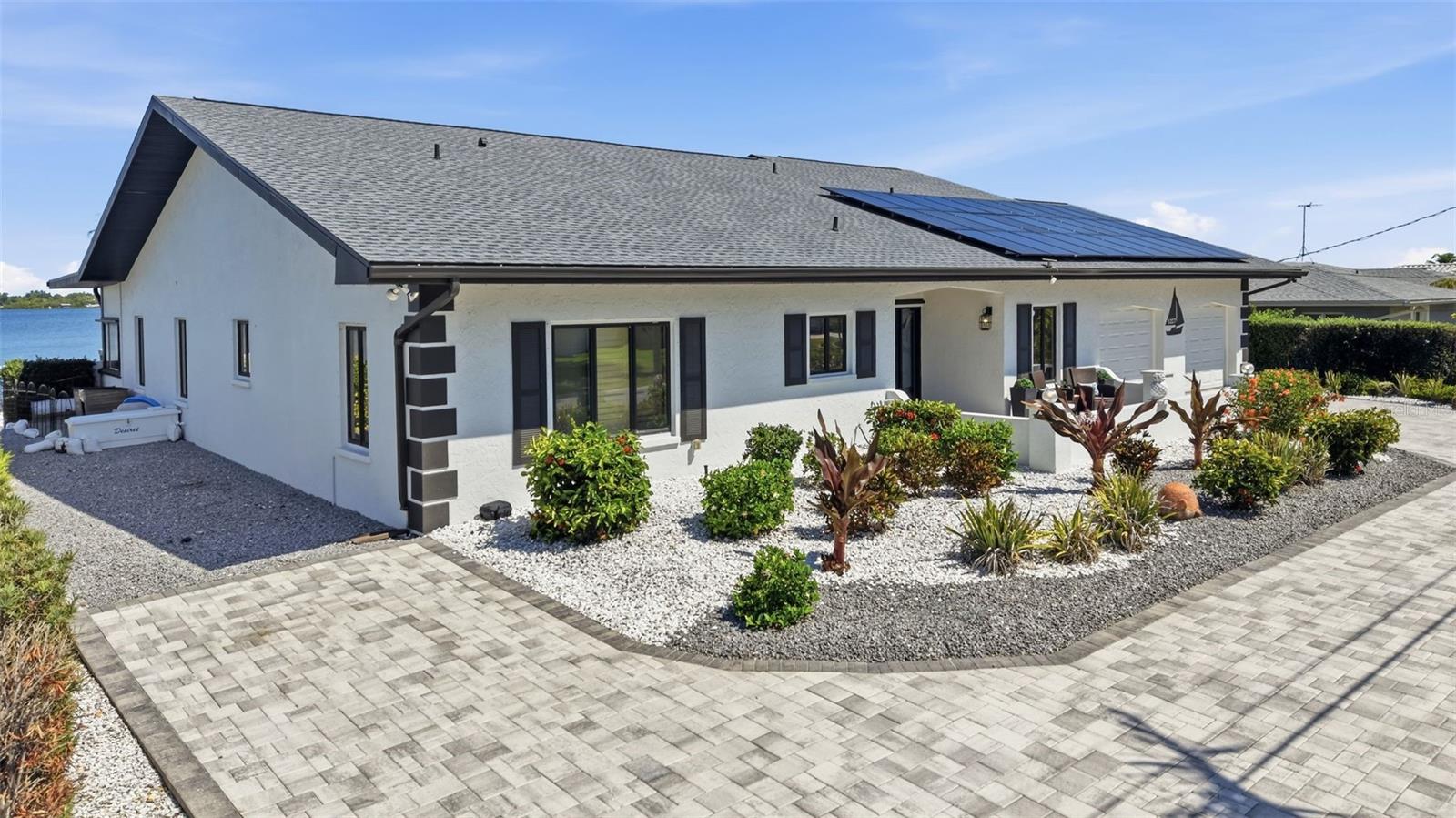 Welcome to your fully reimagined open-water retreat in Palmetto, where modern upgrades, effortless coastal living, and long-term peace of mind come together in one exceptional property. Boasting 100 feet of waterfront with unobstructed open water views, this residence offers a rare advantage—no bridges to the Gulf, allowing for seamless boating access and the true Florida lifestyle right from your backyard. Just minutes away, explore Egmont Key’s crystal-clear emerald waters and powder-soft sand beaches, one of the Gulf Coast’s most coveted destinations. Designed for both comfort, ADA accessibility and functionality, this home features true one-floor living, providing ease and accessibility ideal for full-time residents or seasonal owners. Extensively updated in 2025, the property delivers a fully turnkey experience with new tile flooring throughout, fresh interior and exterior paint, and beautifully updated bathrooms. The thoughtfully designed layout offers a perfect balance of open living and private retreat spaces, while the kitchen is equipped with new appliances, including a dishwasher and refrigerator, blending modern convenience with everyday usability. Step outside into your private waterfront oasis. The backyard is designed for both relaxation and entertaining, featuring a resurfaced pool (2025), brand-new pool cage and screens, and a custom pergola—perfect for enjoying warm Florida evenings. Lush new landscaping (2025) and a circular driveway enhance both curb appeal and functionality. For boating enthusiasts, this property is exceptionally well-equipped with a repaired dock (2025) and two private boat lifts: 9,000 lb lift and 16,000 lb lift. Offering flexibility for multiple vessels and immediate access to the open Gulf.

A new retaining wall (2025) provides added durability and long-term shoreline protection, ensuring peace of mind for years to come. This home also stands out for its efficiency and resilience, featuring: Solar panels with minimal electric bills (paid off at closing), Whole-house generator for uninterrupted power, Buried propane tank for reliability and clean aesthetics and Solar water heater. With a brand-new roof (2025) and a history of no flood damage from previous storms, this property offers a level of security and preparedness that is increasingly sought after in today’s market. Ideally located near Tampa, St. Petersburg, and the Gulf beaches, this home presents a rare opportunity for full-time residents, second-home buyers, or those relocating from out of state seeking a move-in ready waterfront lifestyle with direct Gulf access and uncompromised upgrades. This is more than a home, it’s a fully upgraded, open-water coastal investment designed for effortless Florida living.