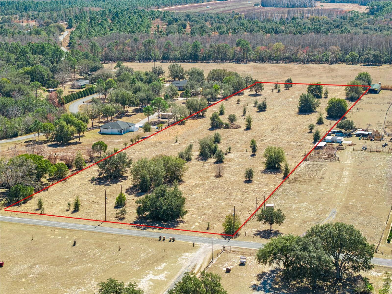 You’re about to uncover a rare opportunity to own 10 high-and-dry acres in Clermont—wide, usable, and ready for whatever vision you have in mind. Mostly cleared with scattered trees, this property offers the ideal balance of open pasture, flexibility, and privacy, making it perfect for building, livestock, agriculture, or creating your own Clermont Ranch lifestyle. The parcel measures approximately 330 feet wide by nearly 1,300 feet deep, providing excellent usability for a custom home, barns, corrals, cross-fencing, or open grazing land. With minimal clearing needed, this property is well suited to bring your plans to life. Situated off a paved road near CR-561, the land offers easy access while maintaining a peaceful, rural feel. You’re just about 15 minutes from shopping, dining, and all that Clermont has to offer. For buyers interested in an existing residence nearby, the same owner is also selling a 3-bedroom, 2-bath pool home on five acres located approximately 550 yards down the road (MLS #G5106113), presenting a unique opportunity to own both land and a home in close proximity. High-and-dry acreage of this size, location, and usability is becoming increasingly difficult to find in Clermont. Schedule your appointment today and explore the possibilities before this opportunity is gone. *Aerial photo property lines are an estimate and to be verified by buyer.