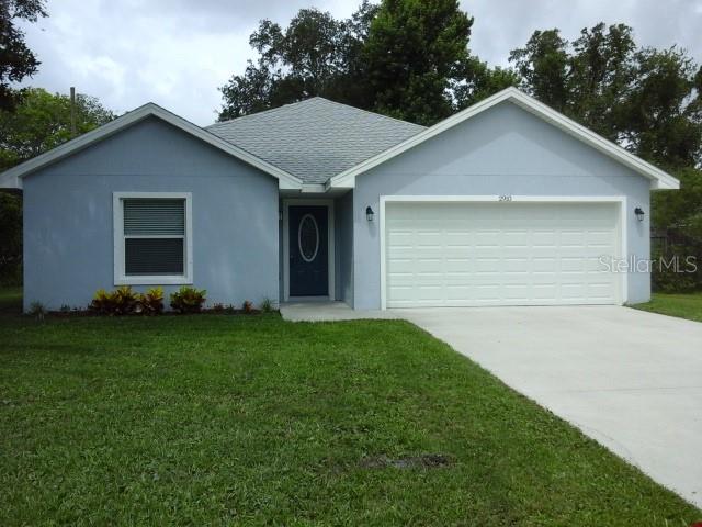 NEW CONSTRUCTION.  Not your Cookie Cutter house located in Edgewater, Florida, Florida Shores Community. No HOA fees here. This is a 3/2/2 car garage Concrete Block Home, with storm shutters, on a large size lot. Plenty of room for a  pool,  shed,  & space for an RV or Boat.   Many upgrades inside to this split plan home:  open and welcoming  floor plan, granite counters in kitchen and baths, wood cabinets-soft close, stainless steel appliances, guest bath has tiled shower and tub area: master has tiled shower, and both are tiled to the ceiling.  Inside laundry room,  attic stairs, garage door opener, upgraded front door & lighting fixtures with ceiling fans, window blinds and verticals.  Survey included with 1 year Contractor's Warranty.  Truely all you have to do is bring your furniture: everything has been done.  Easy to view. Please add this one to your must see list!!! ;Water: City
