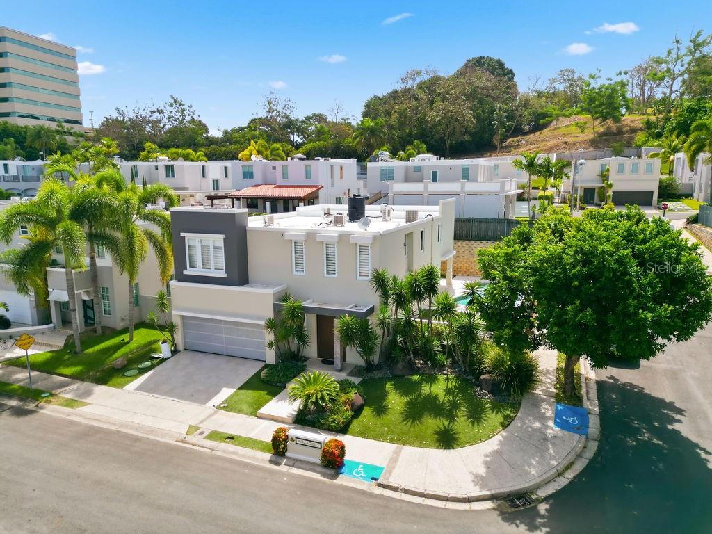 Beautifully expanded and completely remodeled residence located on a corner lot in the exclusive community of Árboles de Montehiedra. This exceptional home features a spacious terrace, swimming pool, and generously expanded bedrooms, each with its own walk-in closet. The oversized primary suite offers two walk-in closets, providing abundant storage and comfort.

The property is equipped with a full backup generator, water cistern, and a two-car garage. Residents enjoy 24/7 gated security and access to outstanding community amenities, including a fitness center, swimming pool, basketball courts, and tennis courts.