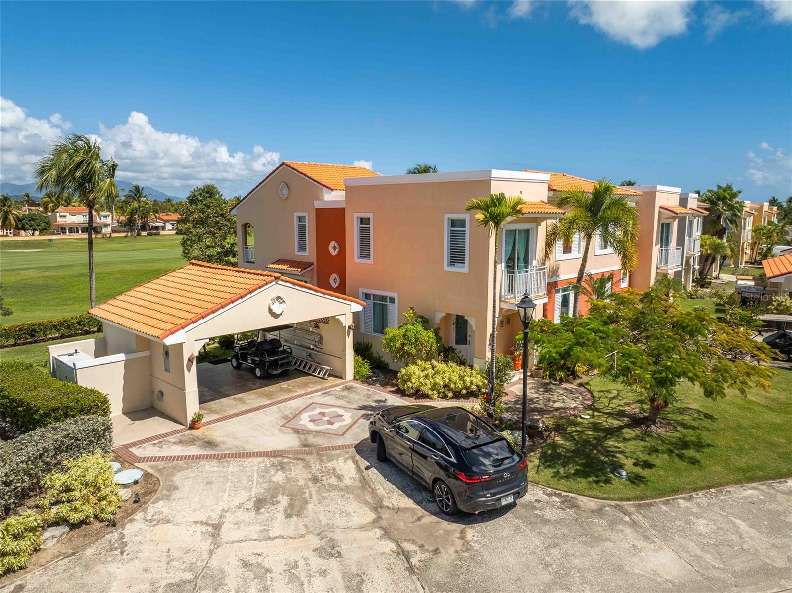 Welcome to 12 Flamboyant Greens, a two-story residence located in an intimate gated community of only 34 homes, offering privacy, space, and beautiful golf course views in the heart of Palmas del Mar. 

This 4-bedroom, 3-bathroom home features approximately 2,400 square feet of living space, high ceilings, and a comfortable layout designed for everyday living and entertaining. The property sits on the second largest lot in the community, with a backyard that opens directly to the golf course, creating a peaceful and scenic setting. 

A private driveway, 20k diesel generator, and access to the community pool add convenience and value, while the quiet, well-maintained neighborhood provides a sense of exclusivity. 

If you're looking for space, privacy, and golf course living within a small gated community, 12 Flamboyant Greens is a unique opportunity. Palmas HOA: $1,300/year Flamboyan Greens HOA: $350/m includes landscaping of the backyard.