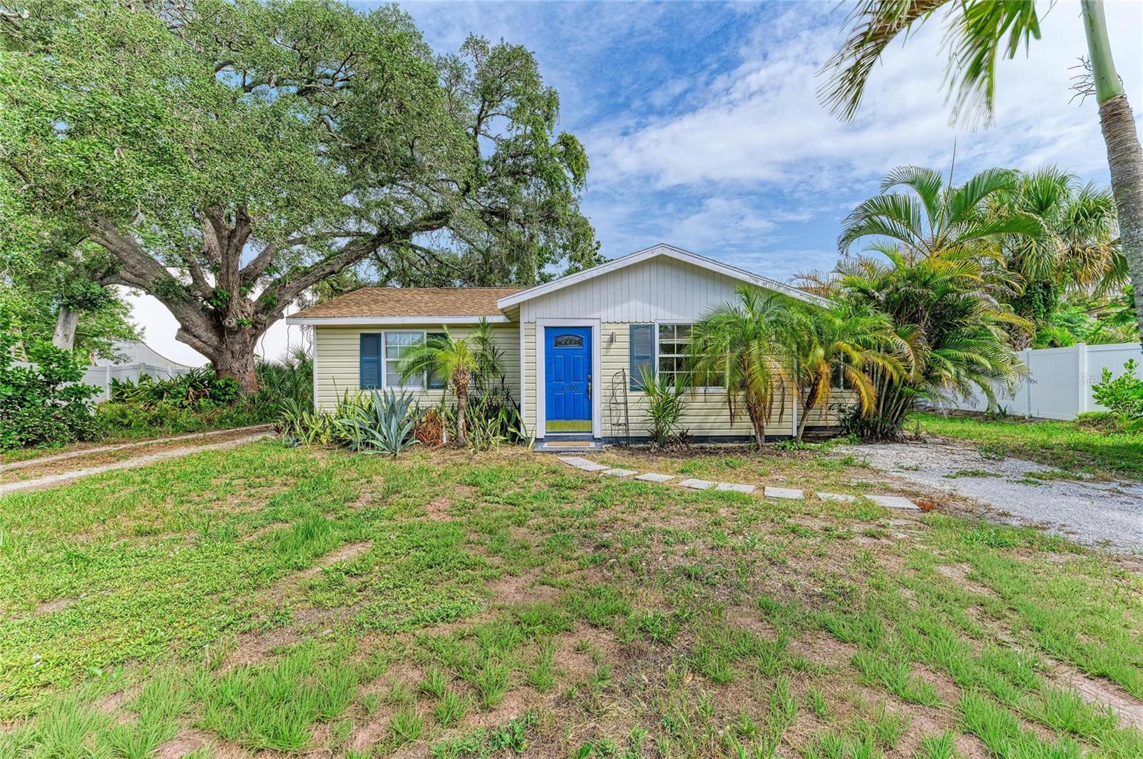 Rarely available, large lot property with so many end uses. This is an exceptional opportunity in one of Sarasota's most sought-after East of the Trail neighborhoods. Situated on an oversized (.32-acre) homesite in the desirable Loma Linda Park subdivision, this unique property offers immediate livability, investment value, and tremendous redevelopment potential. The property features a renovated approximately 1,290 sq. ft. cottage with three bedrooms and two bathrooms, along with a newer 2020 permitted concrete block building totaling approximately 1,458 sq. ft.  The detached structure currently serves as a two-car garage and workshop/studio complete with (2) mini-split air conditioning units, bathroom with shower, and flexible interior space that could potentially be converted into a guest house, artist studio, home office or future two bedroom ADU (subject to applicable approvals). The updated main residence is move-in ready and presents an excellent opportunity as either a comfortable primary residence or an income-producing rental while you plan the future development of the additional structure. The spacious lot also offers ample room to create a custom pool, expansive patio, and exceptional outdoor living area. Surrounded by established homes, newly constructed homes, and mature landscaping, the property is enhanced by a beautiful grand oak tree positioned to the south side of the lot, preserving valuable building flexibility. Located only minutes from Downtown Sarasota, Sarasota Memorial Hospital, Southside Village, Selby Gardens, The Bay Park, Marina Jack, Siesta Key Beach, Lido Key and St. Armands Circle, this property combines an outstanding location with exceptional future possibilities. Whether you're looking to renovate, expand, create a private estate compound, explore future redevelopment opportunities, or rent one or two dwellings long or short term, this oversized parcel offers flexibility rarely found in Sarasota.