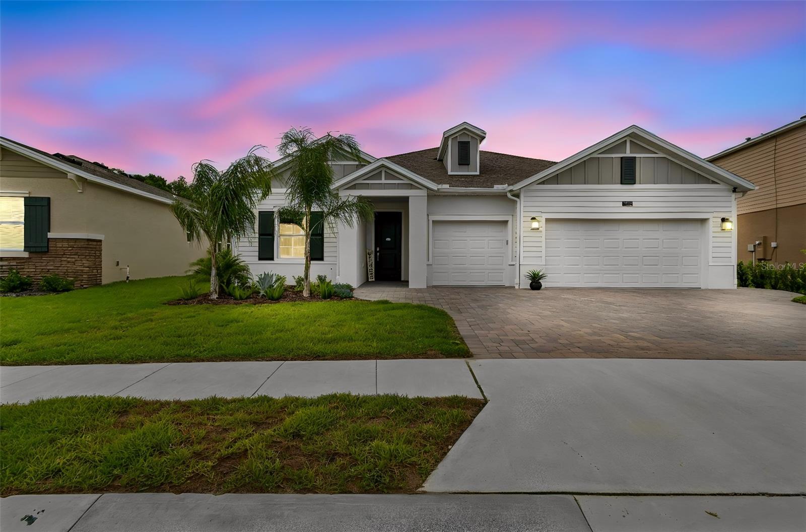 Stunning Estero Model on a Premium Oversized Lot with Water & Conservation Views The breathtaking Estero model offers exceptional curb appeal and is one of the largest floorplans in this Lennar collection, thoughtfully designed to provide an abundance of living space both inside and out. Situated on a premium oversized cul-de-sac homesite, this beautifully maintained residence showcases an open-concept layout that seamlessly connects the kitchen, family room, and dining nook, while sliding doors extend the living area to the covered lanai for effortless indoor-outdoor entertaining. This spacious home features four generously sized bedroom, including a luxurious owner's suite designed for comfort and privacy. The kitchen is equipped with upgraded GE Stainless-Steel, energy-efficient appliances, 42-inch cabinetry with custom pull-out shelving in the lower cabinets, and elegant quartz countertops. Quartz surfaces continue throughout the bathrooms, creating a cohesive and upscale finish. The current owners have thoughtfully enhanced the property with numerous upgrades, including a fully fenced backyard, brick-paved extended walkway, new water softener, 240-volt EV charger, overhead garage storage, screened lanai, all season weather tolerant landscaping and gutters. The true three-car garage provides approximately 670 square feet of space, offering ample room for vehicles, storage, and hobbies. Enjoy tranquil water and conservation views from the expansive covered lanai, creating the perfect setting to relax and unwind. Located within the highly sought-after Providence Golf & Country Club community, residents enjoy luxury resort-style amenities including a fully equipped fitness center, tennis courts, resort-style pool, lap pool, walking trails, dog park, playground, restaurant, pro shop, and more. Golf enthusiasts will appreciate the award-winning Michael Dasher-designed 18-hole championship course spanning 7,046 yards with impeccably maintained greens and multiple tee options for all skill levels. The community's popular on-site restaurant serves breakfast, lunch, and dinner while offering beautiful golf course views. Conveniently located just minutes from major highways, world-famous theme parks, shopping, dining, and entertainment, Providence has earned recognition as the Grand Award community of The Year and continues to be one of Davenport's most desirable gated golf communities. This exceptional home combines luxury, functionality, and an unparalleled lifestyle, an opportunity you won't want to miss.