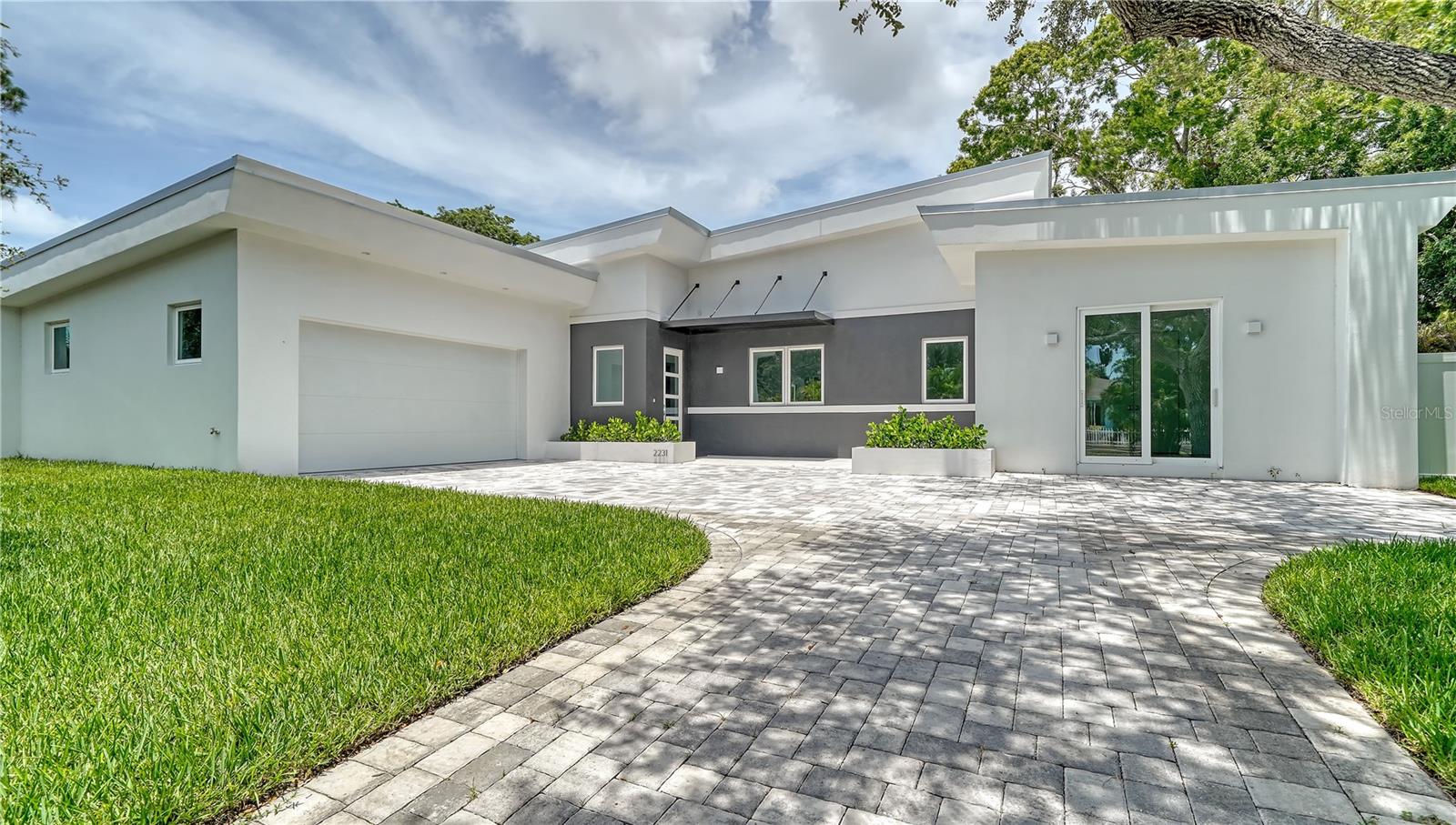 This exquisite new-construction modern residence by Milano Homes, situated on an expansive double lot in the heart of Sarasota, blends elegance, convenience, and investment opportunity. Located within Sarasota city limits, this property qualifies for weekly rentals in one of the area’s most in-demand markets—a highly desirable option that allows for a strong six figure range income annually. This single-story home offers the ultimate in comfort with no stairs to navigate, featuring four spacious bedrooms, three-and-a-half designer bathrooms, and a two-car garage. The outdoor living space is a private sanctuary, complete with a sparkling pool and spa, outdoor shower, and a large fenced yard ideal for both relaxation and entertaining. As with all Milano Homes, the interiors showcase exceptional craftsmanship and imported Italian finishes. From the state-of-the-art kitchen—equipped with Subzero refrigeration, a Wolf induction cooktop, and Wolf oven—to the custom Italian cabinetry, fixtures, and flooring, every detail exudes sophistication. The open-concept living area flows seamlessly into the outdoor retreat, creating the perfect setting for gatherings and indoor-outdoor living. Perfectly positioned, this property offers easy access to the newly extended Legacy Trail, making it a haven for bikers, runners, and nature lovers. Downtown Sarasota’s vibrant arts, dining, and marina scene is just minutes away, while Siesta Key’s award-winning beaches and St. Armands Circle’s luxury shopping and dining are only a five-minute drive. Whether you’re seeking a full-time residence, seasonal retreat, or an income-producing short-term rental, this home offers an unmatched opportunity to enjoy and invest in the Sarasota lifestyle. Work hand-in-hand with the dedicated Milano Homes professionals to personalize this custom residence, creating a one-of-a-kind dream home tailored just for you.