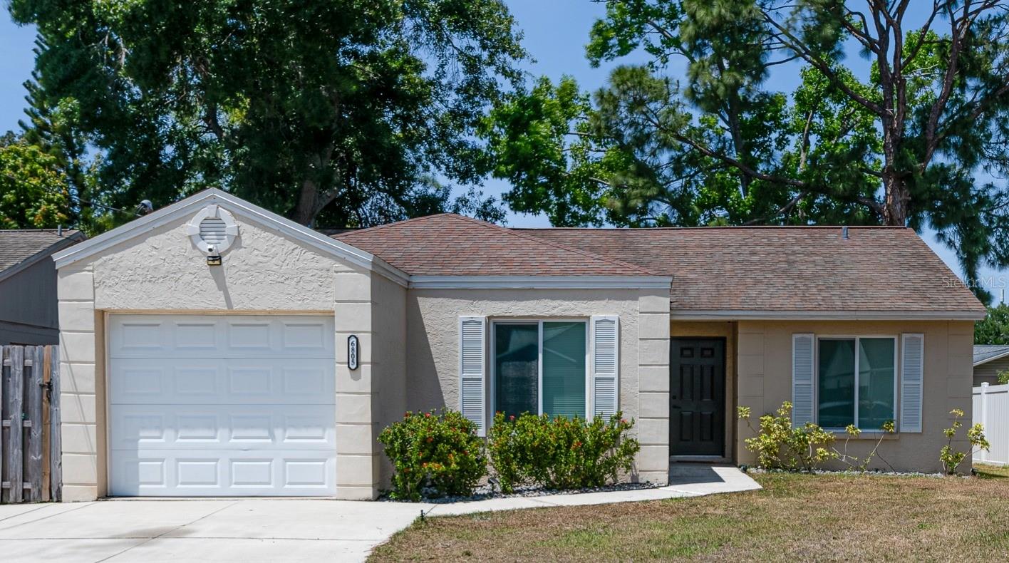 Welcome to 6805 S Gabrielle Street — a bright and beautifully updated 3-bedroom, 2-bathroom home tucked away in the heart of South Tampa next to Gadsden Park. With 1,215 square feet of thoughtfully designed living space, this home offers the perfect blend of style, comfort, and convenience for today’s modern family. Step inside to an airy open-concept layout, where sunlight dances across brand-new flooring and into a warm, inviting living room that flows effortlessly into the dining area — ideal for family dinners or weekend brunches. The fully renovated kitchen is a true showstopper, featuring crisp white shaker cabinets, quartz countertops, stainless steel appliances, and plenty of storage to make meal prep a breeze. Both bathrooms have been tastefully updated with sleek new vanities and fixtures, and all three bedrooms offer cozy retreats for rest, play, or productivity. The home includes a 1-car garage, providing extra storage or space for hobbies and weekend gear. Outside, enjoy a private, fenced backyard — perfect for little ones, pets, or hosting casual BBQs under the Florida sun. Located just minutes from MacDill Air Force Base, this home is also conveniently close to parks, top-rated schools, and all the dining, shopping, and charm South Tampa is known for. Whether you're starting fresh or putting down roots, 6805 S Gabrielle Street is the move-in ready home your family has been waiting for!