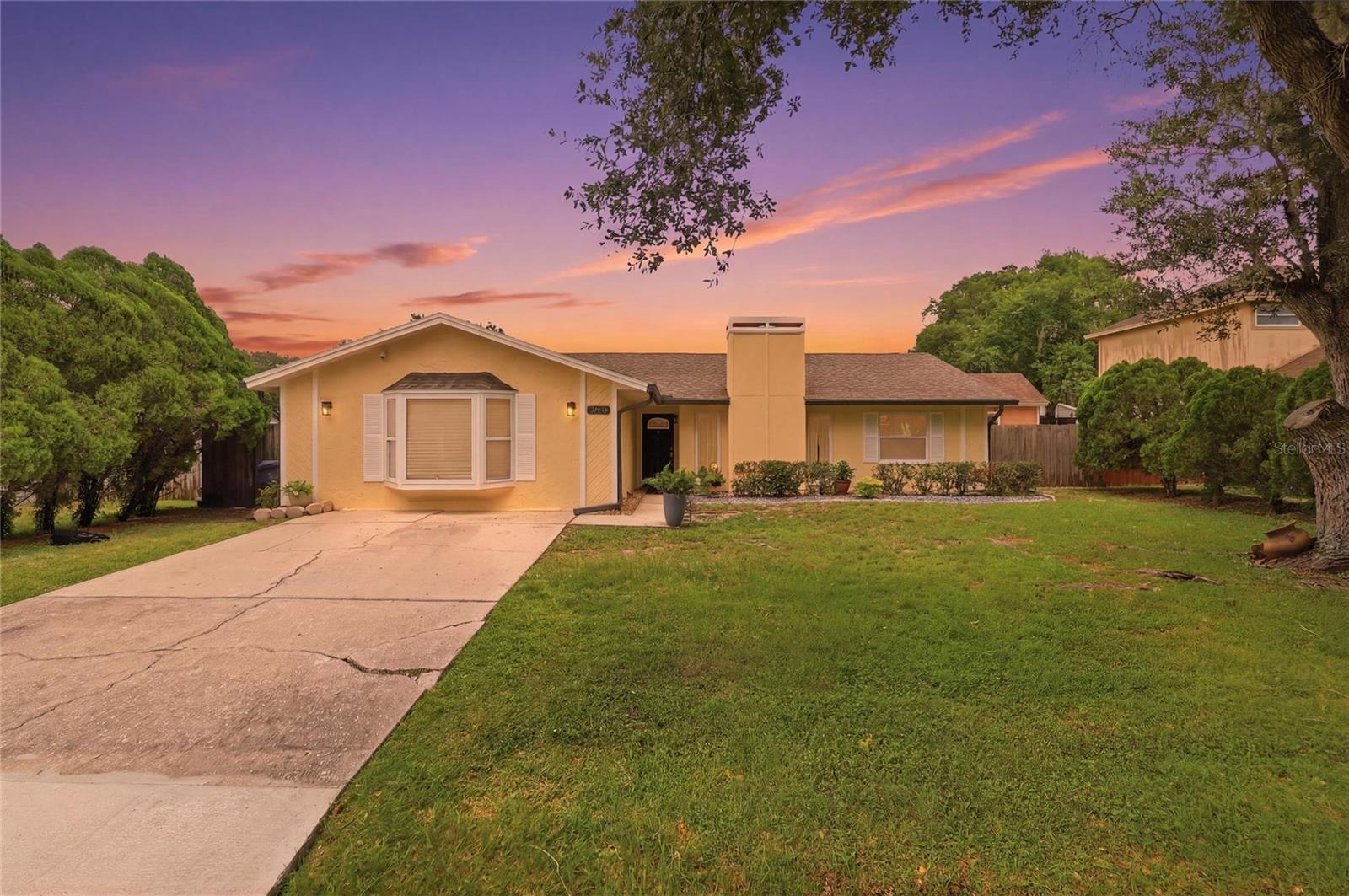 Welcome home to this beautifully updated 3-bedroom (PLUS flex space with a window and closet), 2-bath home in a desirable Lakeland community! Featuring tile flooring throughout, a cozy wood-burning fireplace, and fresh exterior paint, this home is move-in ready with thoughtful updates throughout. Enjoy new light fixtures, a new A/C, roof (2022), gutters (2023), new fence, and a new water softener for added peace of mind. The versatile fourth bedroom/office or additional family room offers its own private entrance, making it ideal for a home office, guest suite, hobby room, or additional living space. Conveniently located near shopping, dining, and major roadways, the neighborhood also offers a community playground for residents to enjoy. Don't miss your opportunity to make this one yours!
