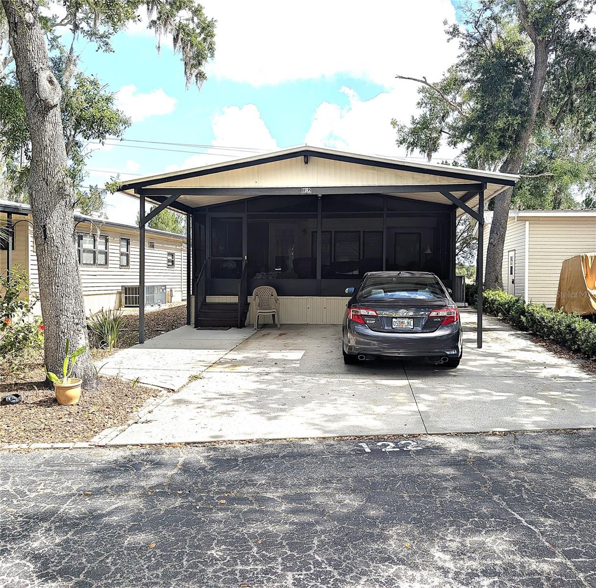 This home has the best screened in porch! It is large and comes furnished! This homes has a golf course and pond view. In addition, this home features 2 bedrooms and 1 bath with a walk in shower. This home will make a perfect winter home or full-time living. And don't forget the large 2 car carport! This property is situated on a pet lot. The board has discussed a potential special assessment that requires voter approval. There has been no approval as of May 2026.