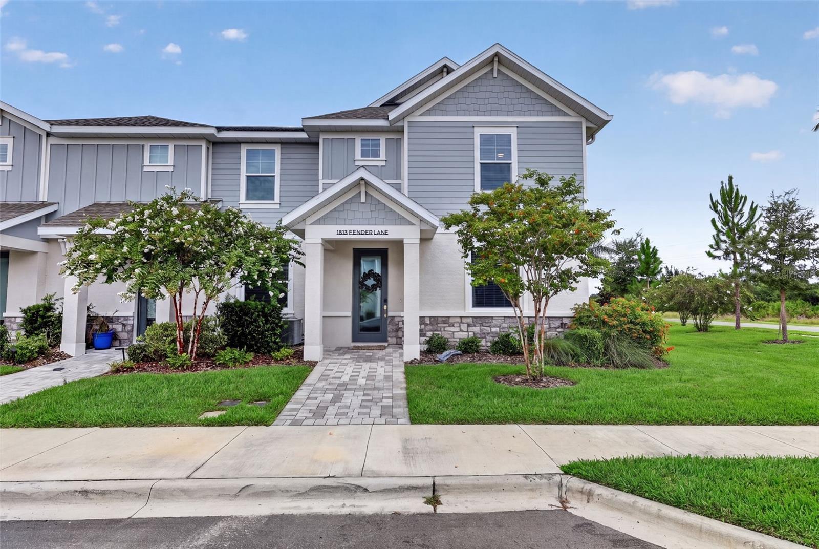 Better than new and move-in ready! Skip the wait for new construction and enjoy this beautifully designed 3-bedroom, 2.5-bath townhome with a versatile den/flex room and a spacious 2-car garage in the sought-after Nautique at Waterside community.

Step inside to discover a welcoming flex space just off the entry, perfect for a home office, playroom, fitness area, or media room. Continue into the comfortable open living area, where the room seamlessly connects to the stylish kitchen, creating the perfect space for everyday living and entertaining. The modern kitchen features abundant cabinetry, generous counter space, a large center island, pantry storage, and beautiful views overlooking the lanai, the perfect place to enjoy your morning coffee while taking in the sunny Sarasota skies.

Upstairs, you'll find all three bedrooms, two full baths, and a convenient laundry room. The spacious owner's suite offers large windows that fill the room with natural light, a generous walk-in closet, and a private en-suite bath. The home has been tastefully updated throughout with modern lighting and designer hardware, creating a fresh, contemporary feel.

Enjoy the Florida lifestyle with Nautique's exceptional resort-style amenities, including a community pool, pickleball courts, playground, and dog park. Within walking distance of Waterside Place, you'll enjoy an abundance of dining, shopping, entertainment, and community events just minutes from your front door.

With a low monthly HOA that includes lawn care, exterior maintenance, and community amenities, this home offers truly low-maintenance living. Conveniently located near Lakewood Ranch, University Town Center, top-rated schools, and the area's renowned Gulf Coast beaches, this is an incredible opportunity to enjoy the very best of Sarasota living.