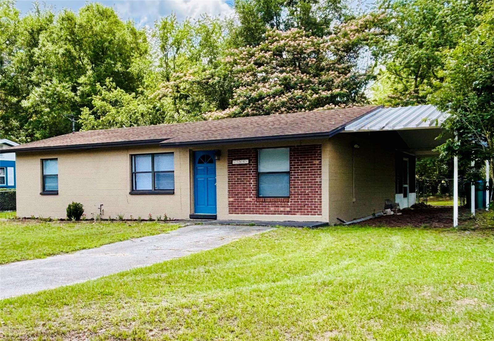 This charming 3-Bedroom starter home in peaceful Alachua is move-in ready! Welcome to 13601 NW 141st Place in Alachua, a delightful single-story home perfectly suited for first-time buyers, young families, couples, or anyone seeking an affordable slice of North Central Florida living. This 3-bedroom, 1-bathroom gem offers comfortable living spaces, upgrades throughout, and a large, private backyard that invites outdoor enjoyment. Step inside to find an abundance of natural light and a functional layout. The kitchen boasts warm oak cabinets and a stylish tile backsplash, with newer appliances and lighting. It flows seamlessly into the living and dining areas, where durable ceramic tile flooring creates an easy-care, open feel. The bedrooms feature fresh vinyl laminate flooring installed in 2024, providing a modern touch and comfort underfoot. The full bathroom is inviting with its white vanity, granite countertop, generous tub/shower combination, and bright lighting. Recent major improvements make this home truly turnkey: a brand-new air conditioning system (2024), PEX plumbing throughout, newly screened back porch (2025), and a reliable asphalt shingle roof. Just unpack and enjoy! Outside, the spacious backyard is a true highlight. Mature trees provide shade and privacy, including a beautiful flowering tree perfect for relaxing under. There's plenty of room for play, gardening, or entertaining, plus a handy storage shed. The front yard and curb appeal shine with the welcoming, expansive yard, brick accents, and lush Florida landscaping.Alachua offers the perfect blend of small-town charm and modern convenience, located just minutes from Gainesville. Enjoy easy access to UF, Shands Hospital, vibrant job opportunities, parks, excellent schools, and abundant nature trails and springs. With friendly neighbors, a reasonable cost of living, and beautiful year-round Florida weather, it’s an ideal setting for young professionals, growing families, couples, or anyone seeking a peaceful, welcoming community with room to grow. This is an incredible opportunity to own a well-maintained, updated home in a desirable location at an entry-level price point. Contact me to schedule your showing today!