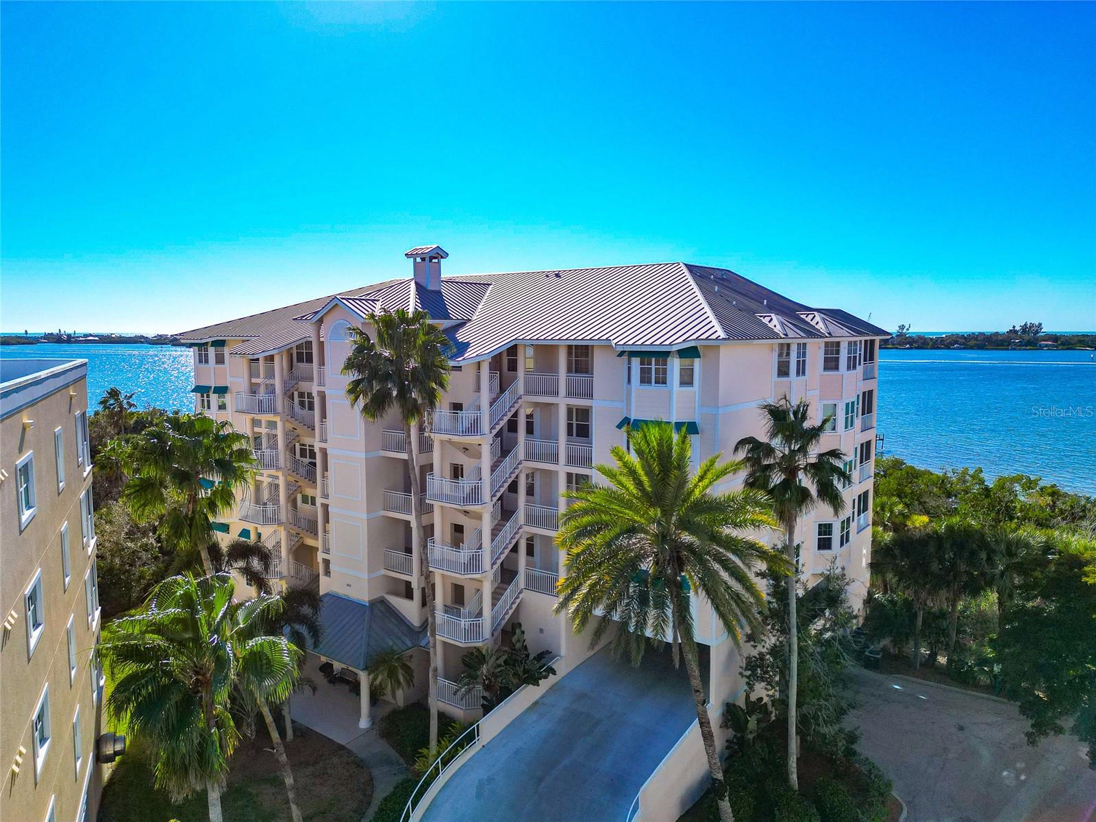 Penthouse Waterfront Residence | Enclosed Sunroom | Private Two-Car Garage | Optional Furnishings | Gated Bayfront Community

This 6th-floor penthouse waterfront condominium at Hidden Bay offers unobstructed views of Little Sarasota Bay, the Intracoastal Waterway, and the Gulf beyond Casey Key. Designed to capture light and water views throughout the main living areas, the open floor plan features high ceilings, tall interior doors, and crown molding, creating a bright and welcoming coastal interior.

The great room accommodates both living and dining areas and opens to an enclosed waterfront sunroom, an ideal space for morning coffee, sunset views, or quiet time overlooking the bay. The kitchen includes a counter-height breakfast bar, pantry storage, and an adjacent dining nook, offering both function and ease for everyday living or entertaining. A den provides flexible space for a home office or guest use.

The primary suite features multiple closets and an en suite bath with dual vanities, a soaking tub, walk-in shower, water closet, and a dedicated makeup vanity area. A second bedroom includes an adjoining bath and walk-in closet. Luxury vinyl flooring has been added in the bedrooms and den. Laundry is located inside the residence.

The condominium includes a private, fully enclosed two-car garage. Furnishings are included and may remain or be removed at the buyer’s preference.

Hidden Bay is a gated waterfront community set along Little Sarasota Bay, offering a clubhouse with fitness center, heated pool and spa, tennis and pickleball courts, kayak storage and launch, and a boardwalk through mangroves leading to a fishing pier. Located west of US 41 in Osprey, Hidden Bay is conveniently positioned between Sarasota and Venice, with nearby access to shopping, dining, the Legacy Trail, and area beaches.