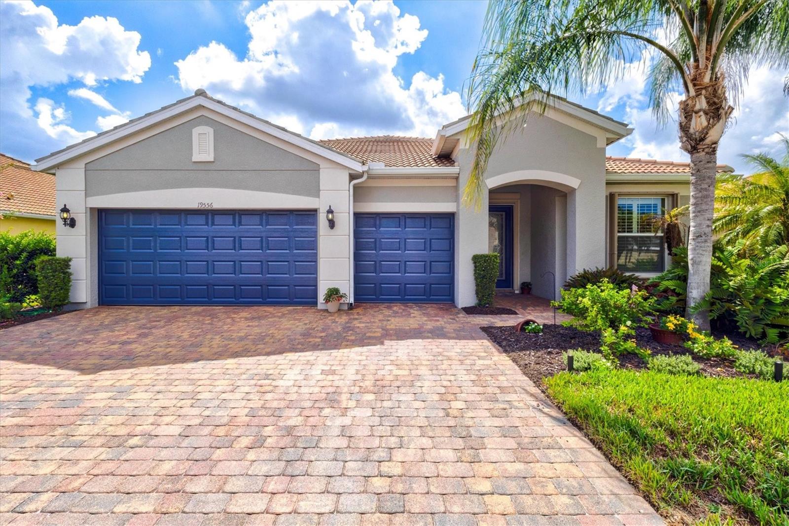 Nestled on **one of the largest homesites in all of IslandWalk**, this exceptional **Cambridge model** offers the perfect combination of privacy, space, and luxury. Featuring **3 bedrooms, 3 full bathrooms, a versatile flex room, and an oversized 3-car garage**, this meticulously maintained residence is designed for both everyday living and effortless entertaining.

From the moment you arrive, you'll appreciate the home's outstanding curb appeal with its freshly painted exterior, lush landscaping, and expansive lot overlooking a peaceful preserve where native Florida birds and butterflies provide a tranquil backdrop. The spacious screened lanai and covered outdoor living area create the perfect setting for morning coffee, outdoor dining, or simply relaxing while enjoying the private views.

Inside, the thoughtfully designed split-bedroom floor plan offers over-the-top functionality with soaring ceilings, 8-foot interior doors, abundant natural light, and an open-concept layout that feels both spacious and inviting. Diagonal tile flooring flows throughout the main living areas, complemented by neutral finishes that provide a timeless look.

At the heart of the home is a chef-inspired kitchen featuring **two oversized islands**, abundant cabinetry, a walk-in pantry, recessed lighting, and generous counter space that makes entertaining family and friends a breeze. The adjoining dining area and expansive great room seamlessly connect to the lanai through triple sliding glass doors, blending indoor and outdoor living.

The spacious owner's suite enjoys peaceful preserve views and features plantation shutters, a custom walk-in closet, dual vanities, and a large walk-in shower. A nearby flex room with solid doors offers endless possibilities as a home office, media room, or hobby space.

Ideal for guests or multigenerational living, one guest suite is privately situated with its own en-suite bath, while the third bedroom offers laminate flooring, plantation shutters, a custom closet, and convenient access to a full guest bathroom.

Additional upgrades include accordion hurricane shutters, a whole-home water filtration system, reverse osmosis at the kitchen sink, generator hookup, laundry room with cabinetry and utility sink, and an included one-year home warranty for added peace of mind.

Located within the highly sought-after, guard-gated community of **IslandWalk at Wellen Park**, residents enjoy resort-style amenities including three pools, two fitness centers, twelve pickleball courts, eight tennis courts, bocce ball, a dog park, library, event center, community kitchens, and a full-time activities director. The low HOA fee includes lawn maintenance, landscaping, mulch, tree trimming, high-speed internet, and cable television.

IslandWalk also offers a private resident entrance to **CoolToday Park**, home of the Atlanta Braves Spring Training, along with convenient access to Downtown Wellen Park, Publix, restaurants, shopping, entertainment, the weekly Farmers Market, beautiful Gulf beaches, golf courses, Historic Downtown Venice, and I-75, making travel to multiple airports quick and convenient.

This is a rare opportunity to own one of IslandWalk's premier homes on one of the community's most desirable oversized lots.