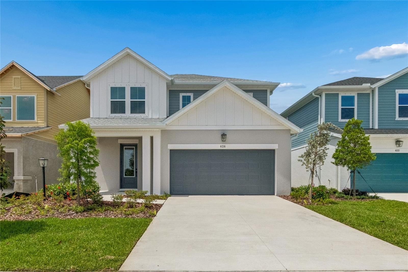 Discover the Zander by David Weekley Homes at Eastlyn in Bradenton, FL, Just ten minutes from I-75 and SR 64 you'll find a two-story home beautifully designed for you, where modern elegance meets everyday functionality. With no CDD Fees and low-HOA, Eastlyn provides a peaceful setting that's close enough to the highway to be convenient, yet far enough away to avoid the big city traffic. Only a 4-minute drive from groceries, 10 minutes to the Costco/Target shopping center where you'll find a variety of stores and top restaurants. Easy access to Sarasota, St. Petersburg, and Tampa allow you to enjoy big city amenities when you want them and the serene relaxation when you don't. This spacious floor plan offers 4 bedrooms, 3.5 bathrooms, 2 car garage and a large upstairs retreat that can serve as a game room, home theater, or quiet reading nook and is backed by David Weekley Homes' comprehensive 1-2-10 warranty. The upgraded gourmet kitchen is a showstopper, featuring an electric cooktop, built in oven/microwave combo, quartz countertops, a large walk-in pantry, and seamless flow into the open-concept dining and family areas. Outstanding use of windows and natural light in the atrium style main living area enhances the luxury throughout and adds an elegant feel. The Owner’s Retreat provides a private escape with a spa-inspired Super Shower, and a spacious walk-in closet. The flooring choices throughout are sure to please with durable laminate flooring running through the main living spaces, blending style with practicality and tile in the bathrooms and carpet in the bedrooms. An extended covered lanai with 12' sliders extends the living space outdoors, perfect for morning coffee or evening conversations under the Florida sky.