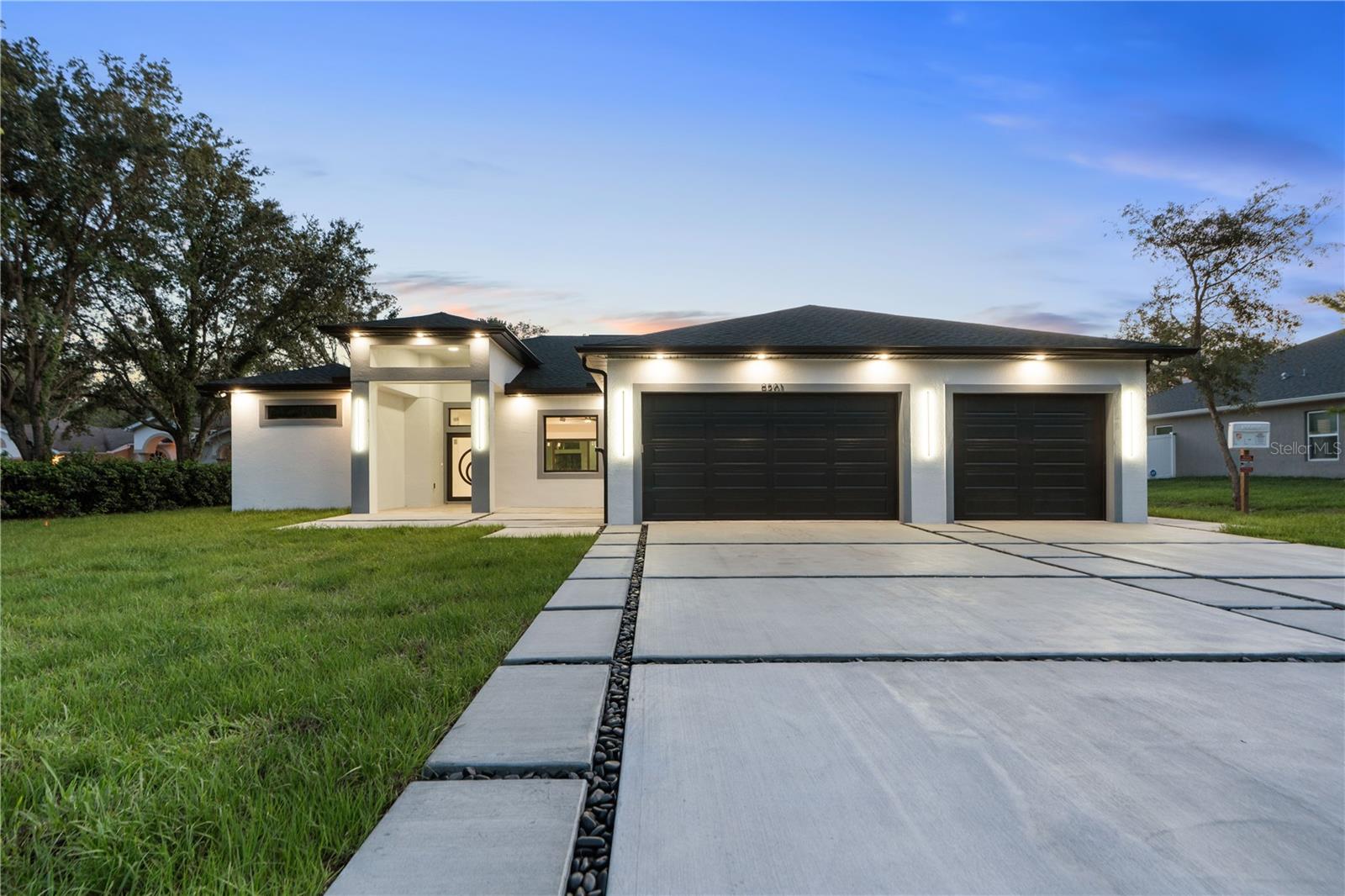 STEP INTO YOUR OWN OASIS WITH THIS METICULOUSLY DESIGNED ONE OF A KIND, NEW CUSTOM-BUILT HOME. THE OWNER DID NOT TAKE ANY SHORTCUTS HERE! SO MUCH TO LOVE IN THIS STUNNING 4 BEDROOM/3 BATHROOM HOME WITH OPEN CONCEPT LIVING SPACE, THE GOURMET KITCHEN HAS BEAUTFUL CUSTOM BUILT CABINETS WITH QUARTZ COUTERTOPS, DOUBLE OVEN, STOVETOP WITH POT FILLER, A GENEROUS ISLAND WITH POPUP COUNTERTOP CHARGING PORTS AND EVEN A GLASS ENCLOSED WINE CELLAR. ELEGANT TILE FLOORS THROUGHOUT ENTIRE HOME. STYLISH IMAPCT WINDOWS AND DOORS WITH DOORS OFFERING EXTRA SAFETY WITH A 3 POINT LOCK, ANTI-THEFT PROTECTION, THIS SHOULD GET YOU AN INSUARNCE DISCOUNT. THE OWNERS SUITE HAS 2 WALK-IN CLOSETS, AND LARGE BATHROOM HAS LUXURIOUS WALK-IN SHOWER, BATHTUB TO RELAX IN. ON THE OTHER SIDE OF THE HOME IS WHERE YOU WILL FIND THE OTHER 3 BEDROOMS AND 2 BATHROOMS. ONE BEDROOM HAS ITS OWN BATHROOM WITH AN EXIT TO BACK PORCH WHERE YOU WILL FIND A SPACIOUS BACKYARD WITH A BEAUTIFUL OUTDOOR KITCHEN PERFECT FOR FAMILY GATHERINGS. YOU WILL DEFINITELY FALL IN LOVE WHEN YOU PULL UP AND SEE THIS UNIQUE DRIVEWAY WITH CUSTOM DESIGN AND SOFFITT LIGHTING SURROUNDING THE HOME. THE FRONT ENTRY AND BACK PORCH BOTH HAVE TRAVERTINE TILE FOR DURABILITY AND EASY TO CLEAN. OH AND DID I MENTION NO HOA'S OR CDD'S!!! THIS HOME IS ONE YOU DEFINITELY WANT TO SEE. SCHEDULE YOUR APPOINTMENT TODAY!