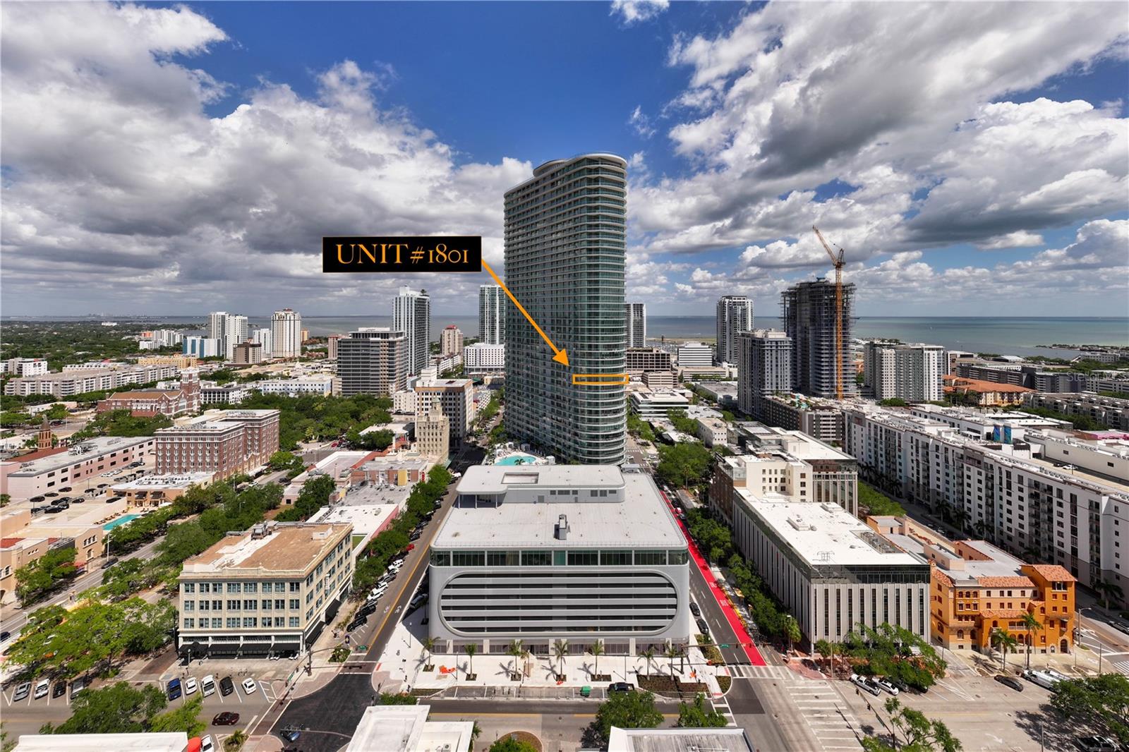 Beyond Standard - Residence #1801 Stands Alone. Rising 46 stories above the heart of downtown St. Petersburg, 400 Central Residences is the tallest condominium tower on Florida's West Coast—an architectural landmark redefining luxury urban living. Positioned on the coveted west curved end of the tower, Residence #1801 is a rare offering featuring three bedrooms, three-and-one-half baths, two parking spaces (one assigned and one valet), climate-controlled private storage, bicycle storage, and nearly $100,000 in premium upgrades. Panoramic views stretch in every direction, with spectacular western vistas delivering St. Petersburg's unforgettable sunsets. While immersed in the energy of downtown, Residence #1801 offers an unexpectedly quiet and private retreat. Expansive wraparound terraces, accessible from every bedroom, create seamless indoor-outdoor living while showcasing the city skyline, Tampa Bay, and beyond. Inside, soaring 10-foot ceilings and walls of floor-to-ceiling hurricane-impact glass flood the home with natural light. Upgraded wood flooring—rare within the building—power-ready for motorized window treatments, and a thoughtfully designed split-bedroom floor plan further distinguish this exceptional residence. The primary suite is a private sanctuary featuring stunning city views, a spacious walk-in closet, an additional built-in closet, and a spa-inspired bath. The guest suites are thoughtfully positioned to maximize privacy and comfort. The gourmet kitchen blends timeless design showcasing rare all-white Italian cabinetry, Quartz countertops, under-cabinet lighting, a waterfall-edge island with seating for four, vented ductwork, a 36-inch six-burner gas cooktop, and premium stainless-steel appliances. Residents enjoy an exceptional collection of resort-style amenities, including a heated pool and spa, private cabanas, fire pits, outdoor lounges, grilling stations, a bocce court, dog park and washing station, Zen garden, state-of-the-art fitness center, private dining spaces, co-working suites, entertainment lounges, theater, and the breathtaking 46th-floor Sky Lounge Observatory with panoramic views from Tampa Bay to the Gulf. Just outside your door, downtown St. Petersburg offers award-winning restaurants, museums, waterfront parks, Spa Beach, marinas, healthcare, universities, and the iconic St. Petersburg Pier—all within easy walking distance. Residence #1801 - Experience elevated city living at its finest.