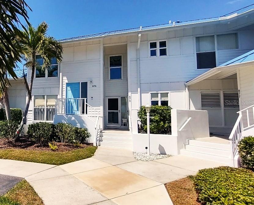 Imagine Resort style living in Perico Bay Club (PBC). PBC is just two miles to the famous sandy beaches of Anna Maria Island and shopping. Light, Bright, and Updated ... this 2 bedroom, 2 bath condo has valuted ceilings, hurricane-impact windows, and comes fully furnished. Don't miss the water views...watch the spoonbills, ducks, hawks, and sparkeling waters of the lake all from your glass enclosed lanai.  PBC offers 24 hr security, an Olympic swimming pool, tennis, pickle ball, fitness center, library, and many scheduled activities if desired. PBC is a true club. The HOA also has a private pool.